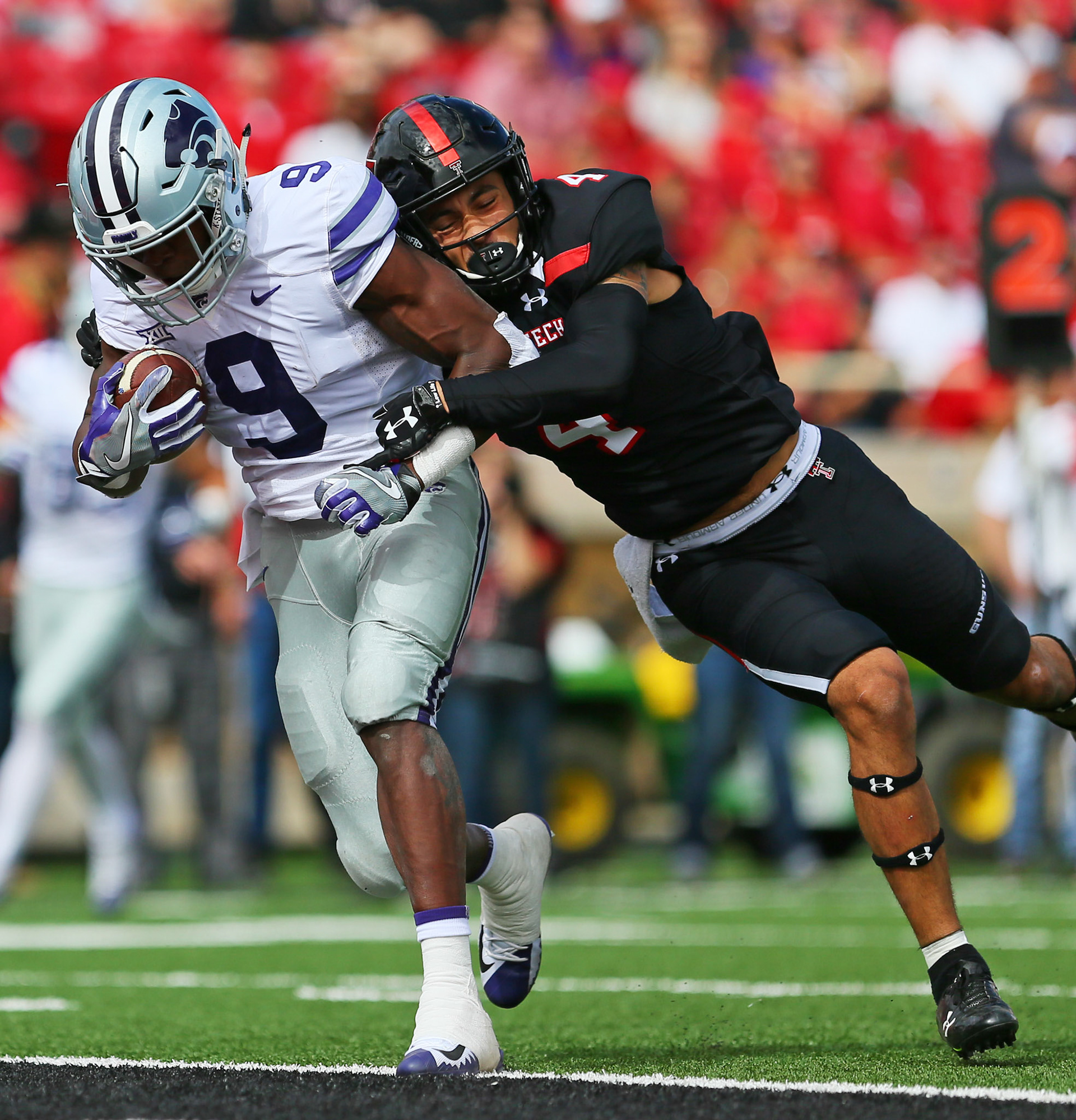 LUBBOCK, TX - NOVEMBER 04: Kansas State wide receiver Byron Pringle (9) carries Texas Tech defensive back Desmon Smith (4) into the endzone to score a touchdown during the Texas Tech Raider's 42-35 loss to the Kansas State Wildcats on November 4, 2017 at Jones AT&amp;T Stadium in Lubbock, TX. (Photo by Sam Grenadier/Icon Sportswire)