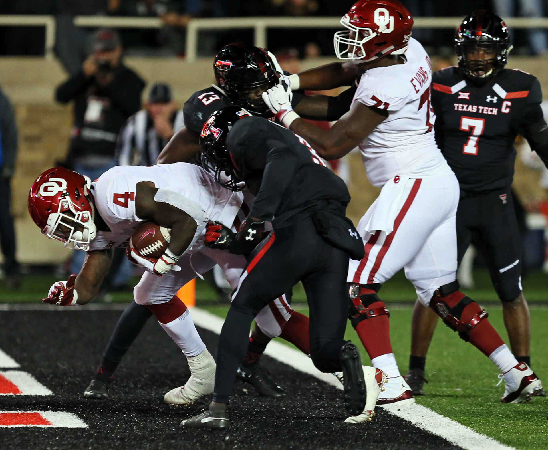 Oklahoma's Trey Sermon (4) scores a touchdown during the game against Oklahoma Saturday, Nov. 3, 2018, at Jones AT&amp;T Stadium in Lubbock, Texas. [Sam Grenadier/A-J Media]