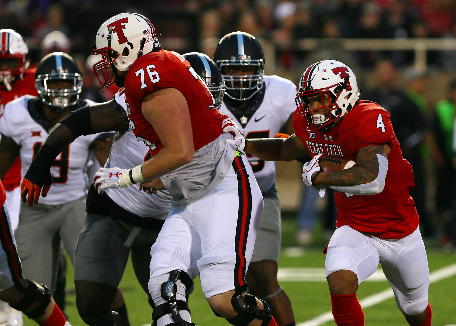 LUBBOCK, TX - SEPTEMBER 30: Texas Tech running back Justin Stockton (4) follows his blockers during the Texas Tech Raider's 41-34 loss to the Oklahoma State Cowboys on September 30, 2017 at Jones AT&amp;T Stadium in Lubbock, TX. (Photo by Sam Grenadier/Icon Sportswire)