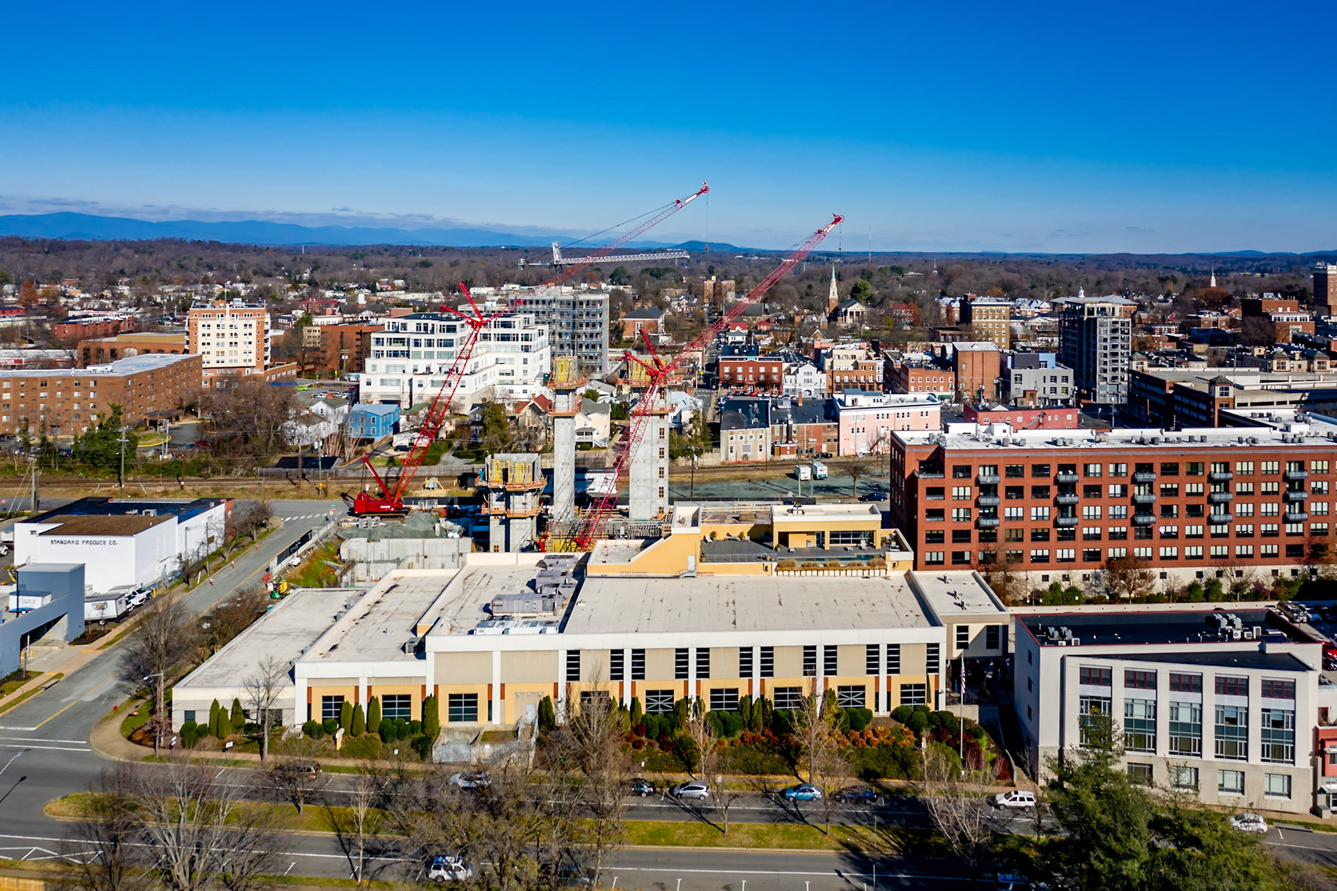 Two giant cranes that dominated the Charlottesville skyline during the construction of Apex Clean Energy building