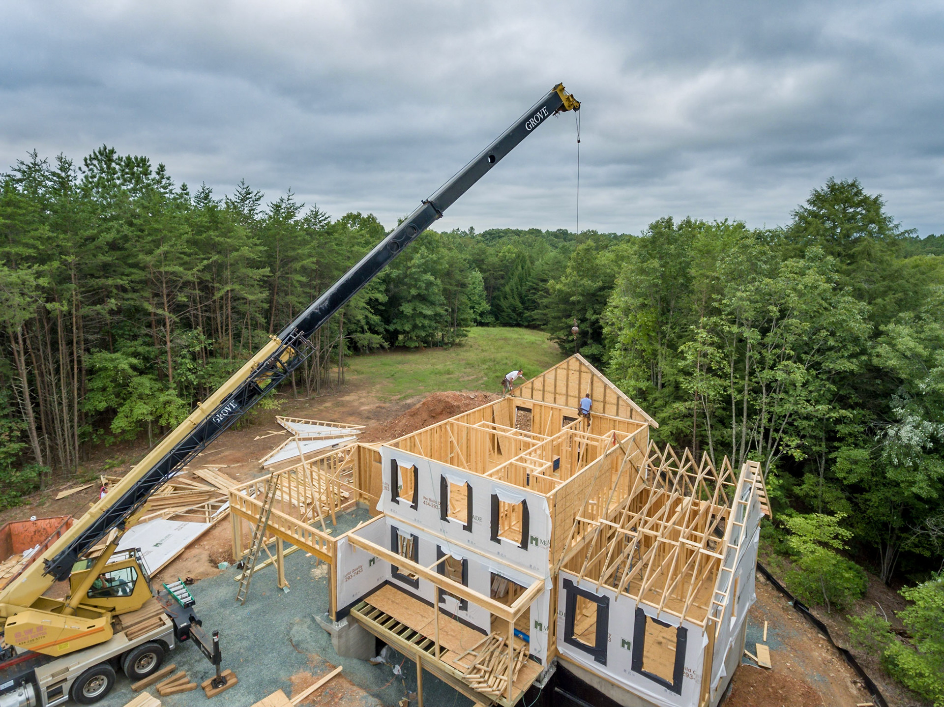 Roof rafters being lifted into place