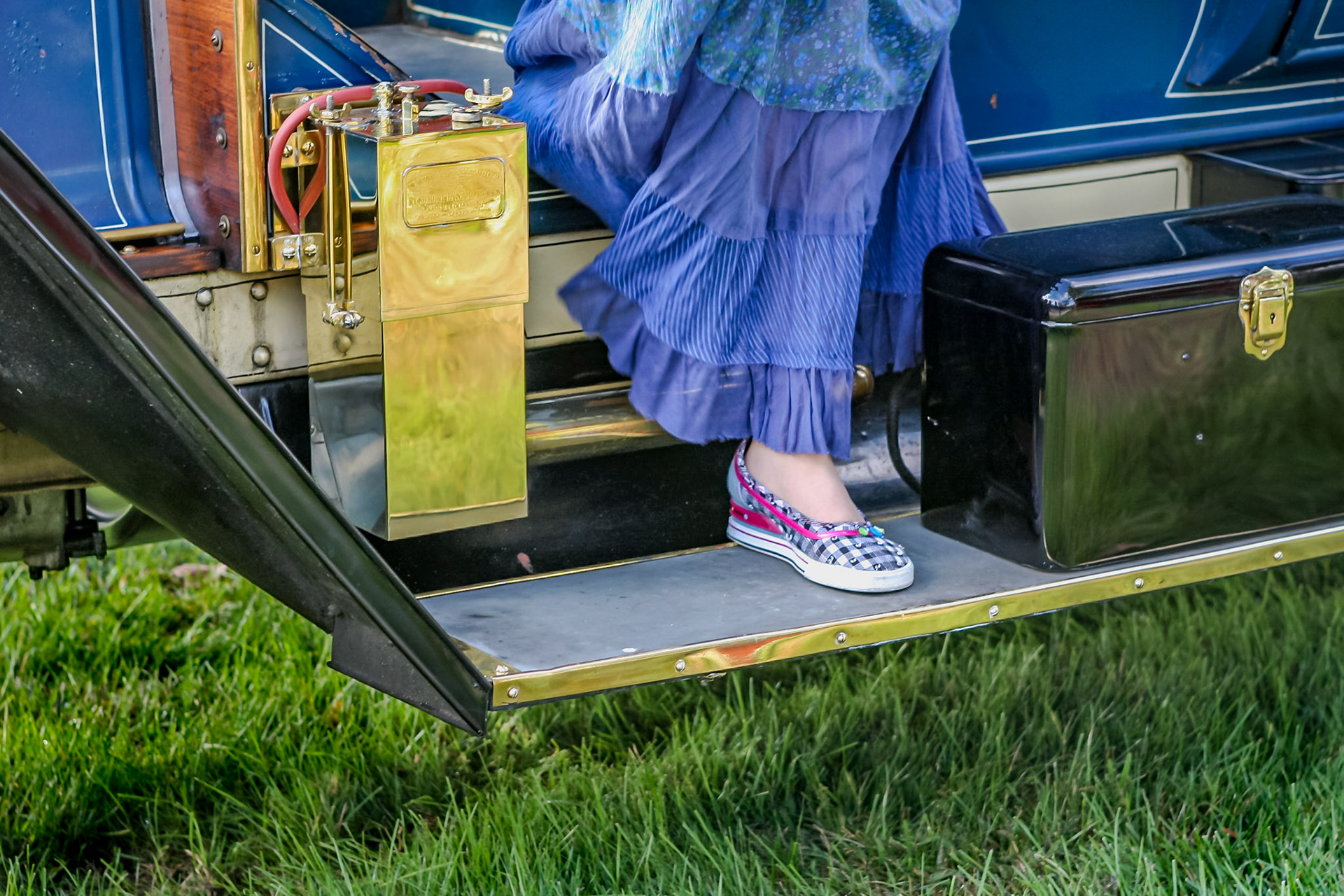 Woman's foot on car running board