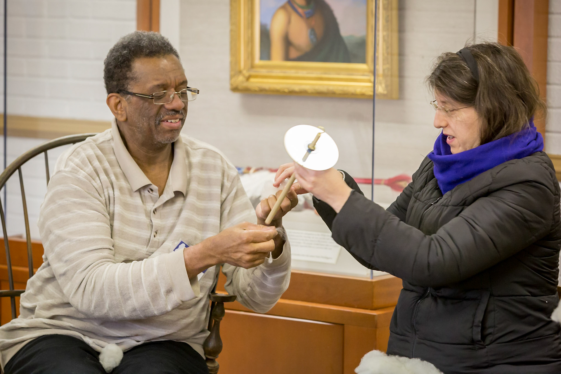 Russell giving instructions in his drop spindle class