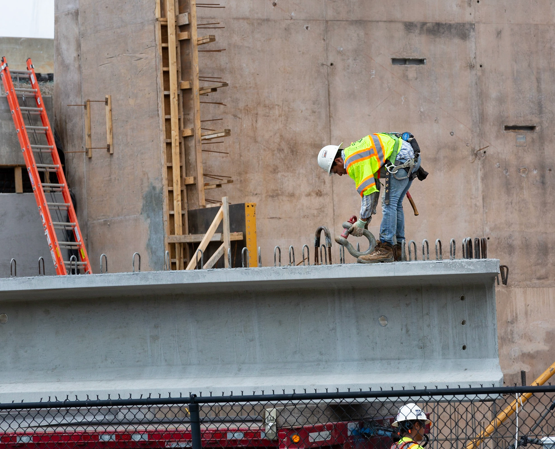 Construction worker in I-beam