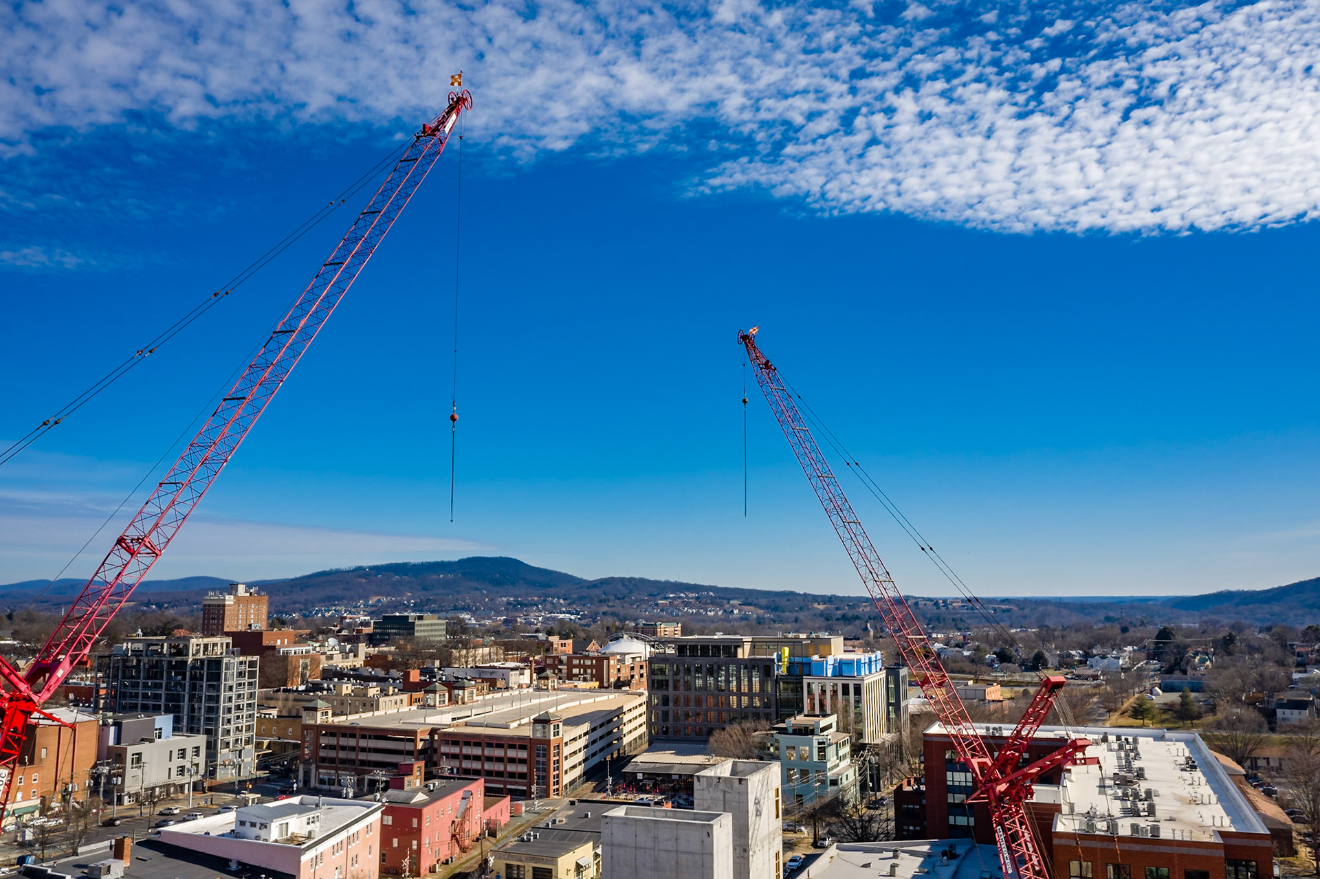 Two giant cranes that dominated the Charlottesville skyline during the construction of Apex Clean Energy building