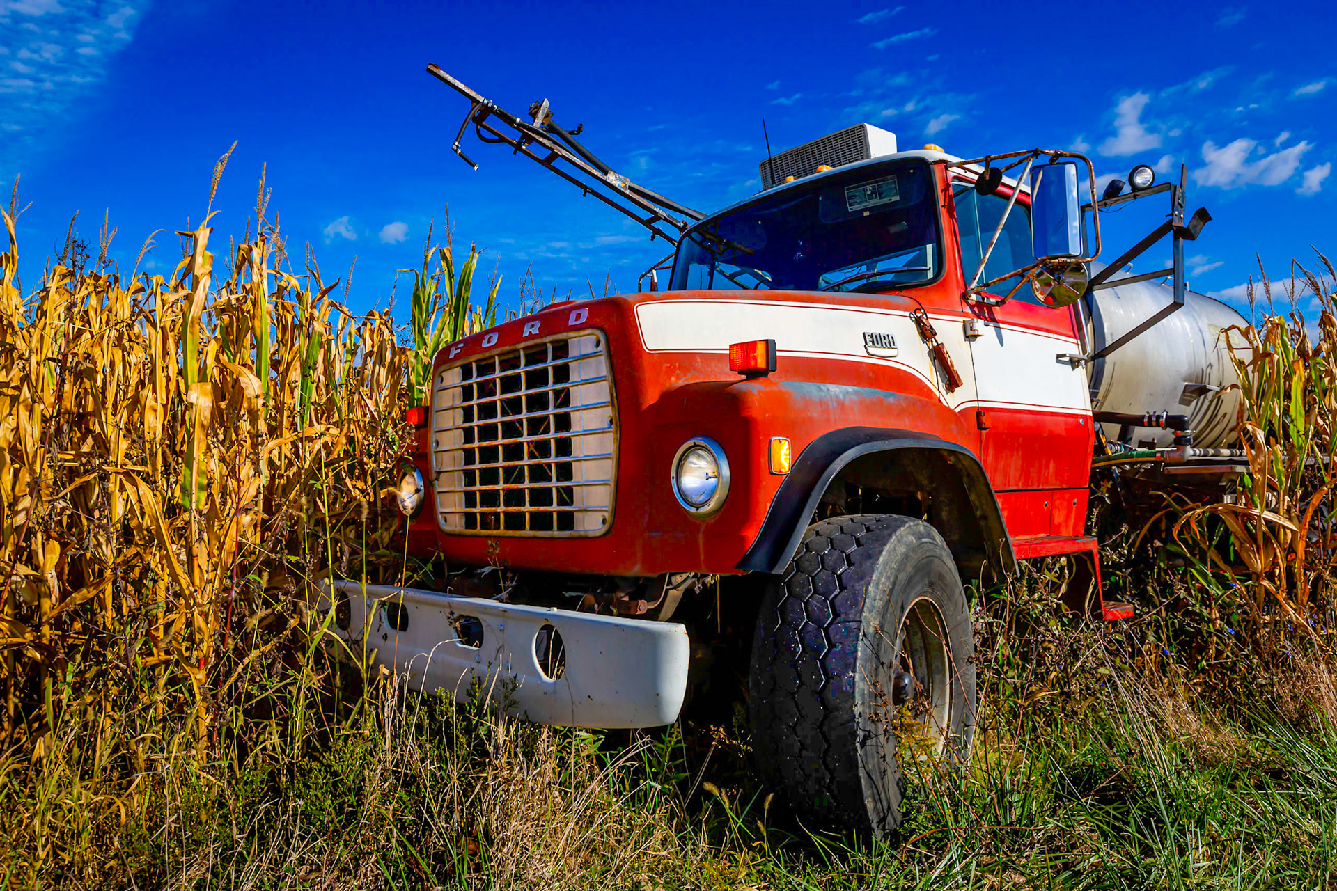 A spray truck in a corn field