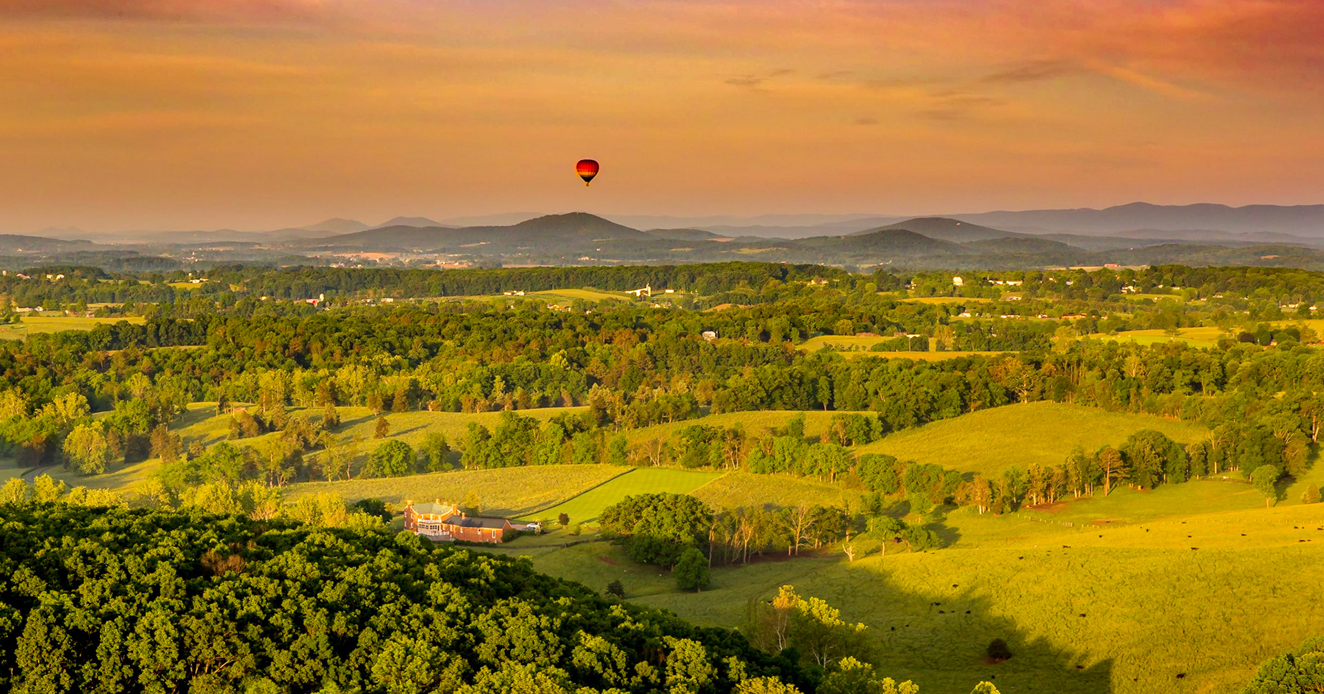 Enjoying a sunrise from an air baloon