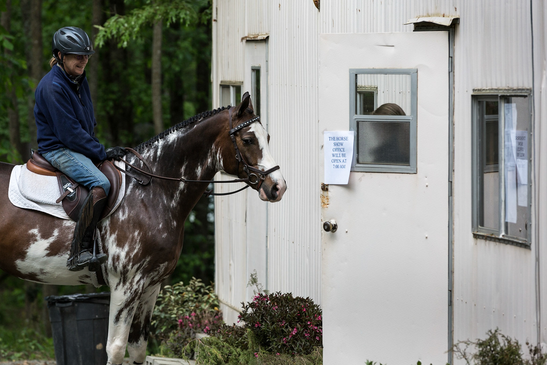 Horse and rider checking in at the office