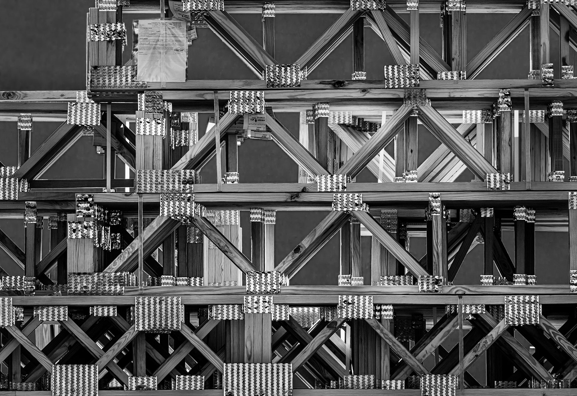 A bundled pile of manufactured floor joists waiting to be installed at The Hudson Apartments construction site.