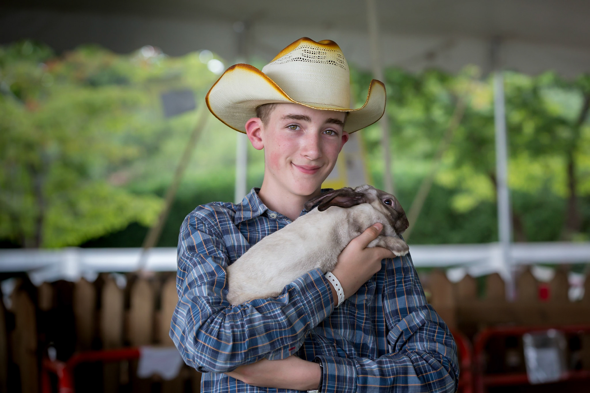 Fair at James Monroe Highlands, a boy with his rabbit