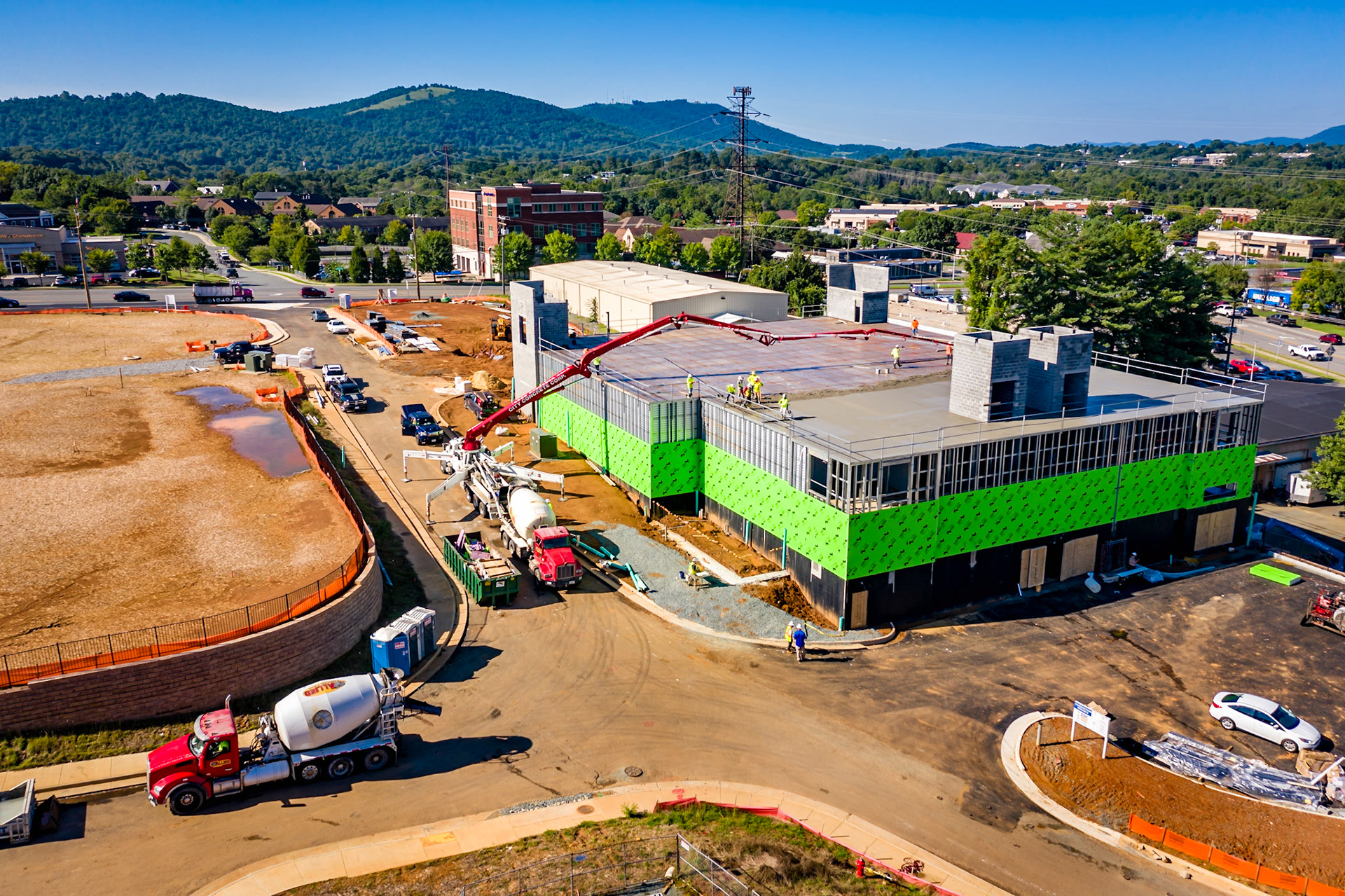 Concrete trucks and concrete pump truck delivering concrete