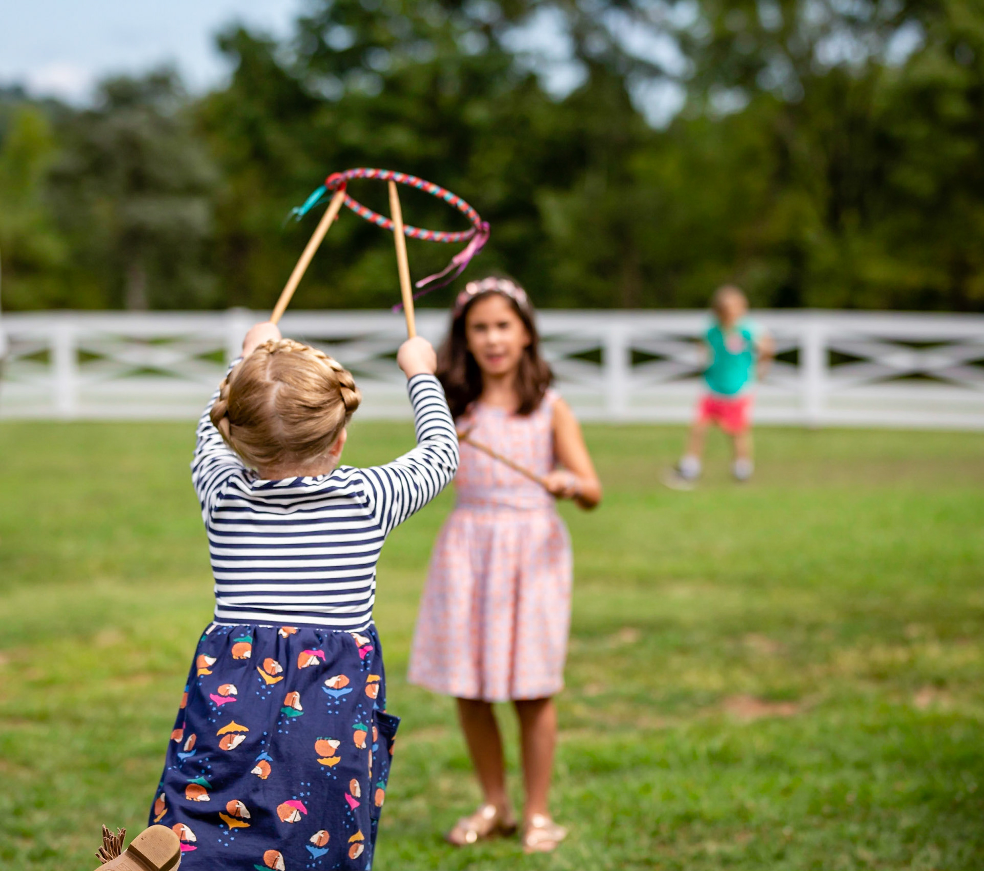 Young girls enjoying simple toys