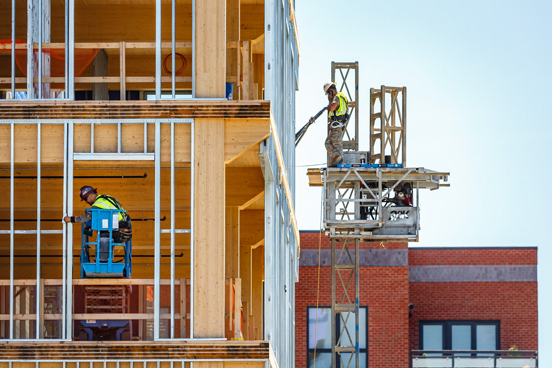Construction workers during the construction of the Apex Clean Energy, a cross laminated timber building