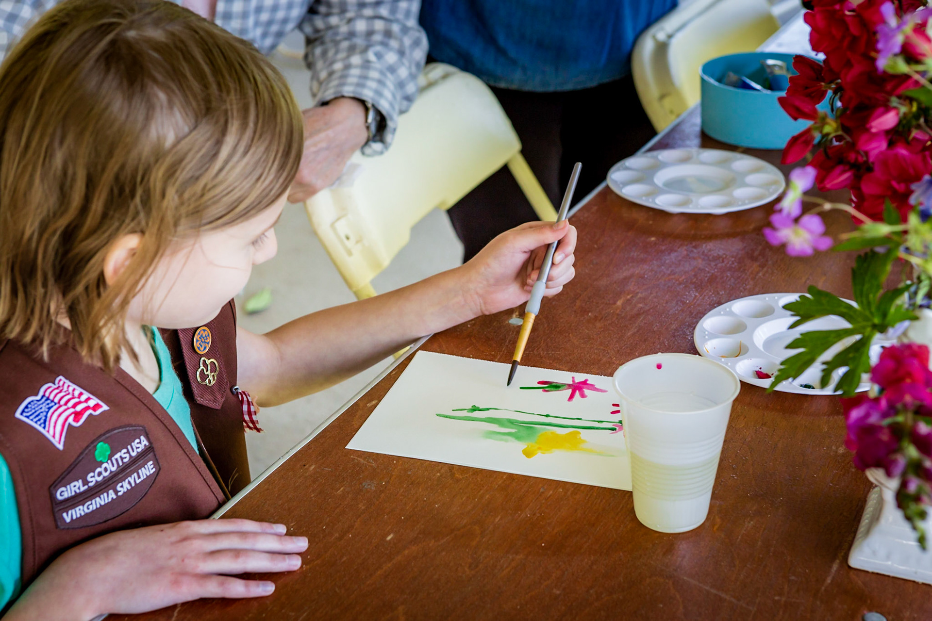 Girl Scout painting with water colors
