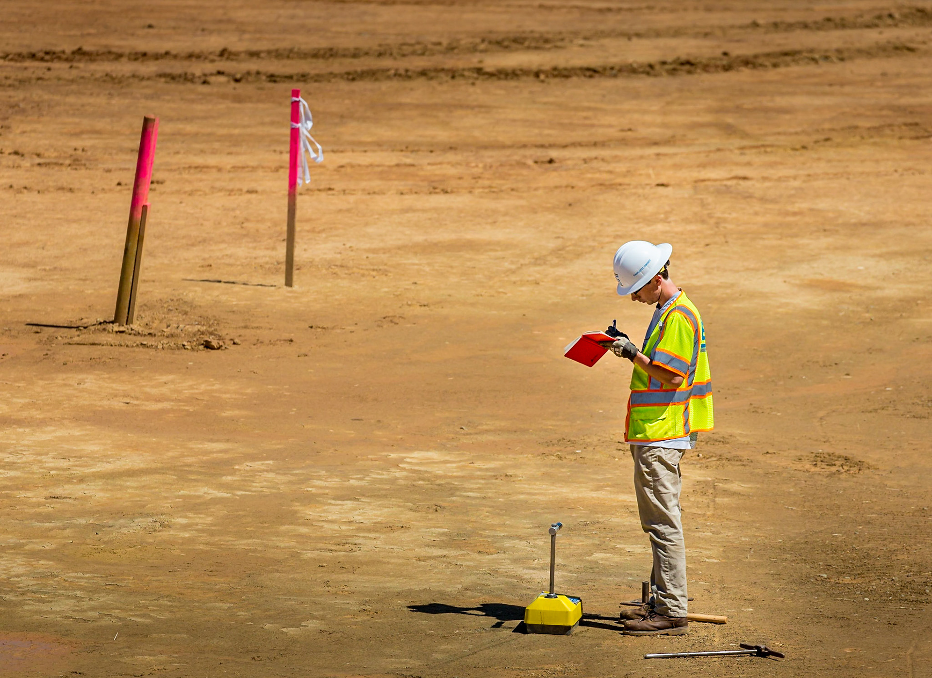 Construction at Pantops, man conducting soil testing on the Wawa site.