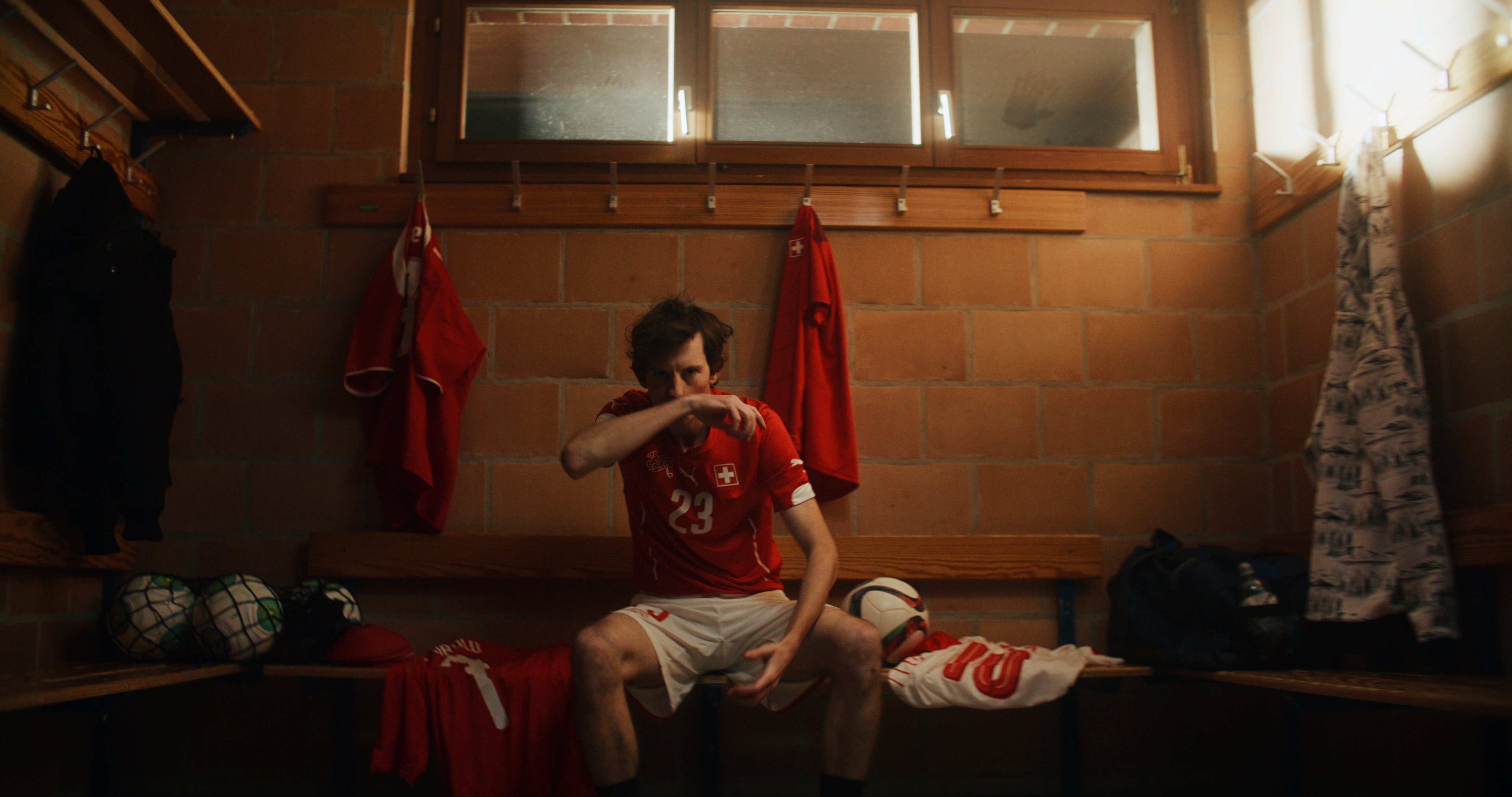 jacob muller footballer waiting in lockers before the match starts