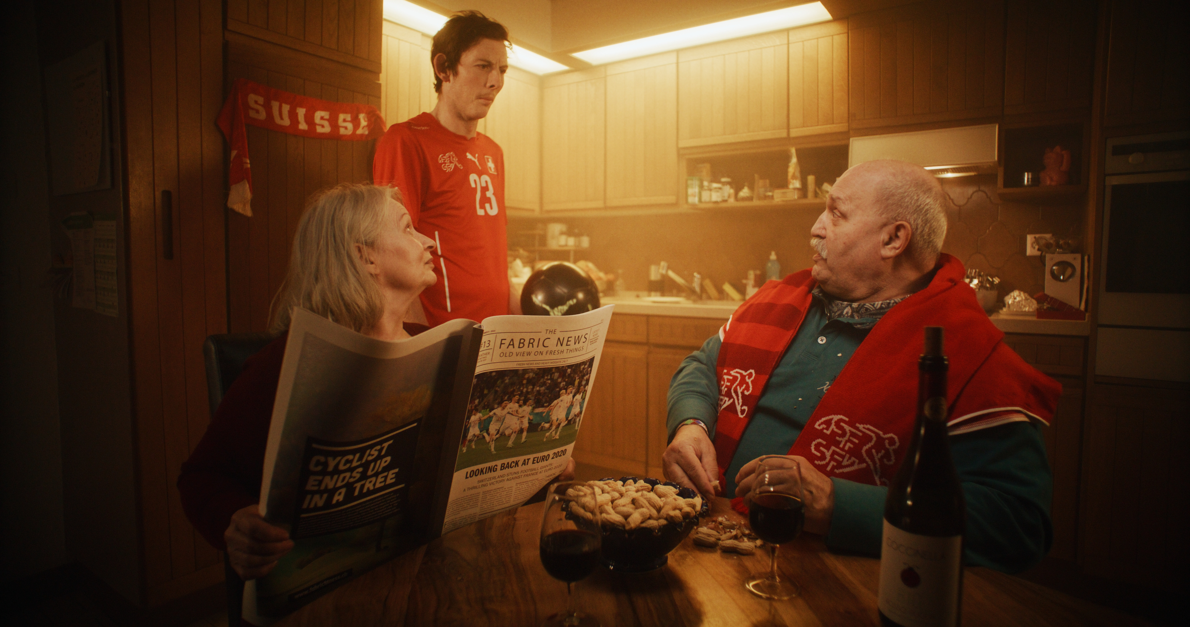 parents at a dining table talking to their son jacob muller jacobmullertv