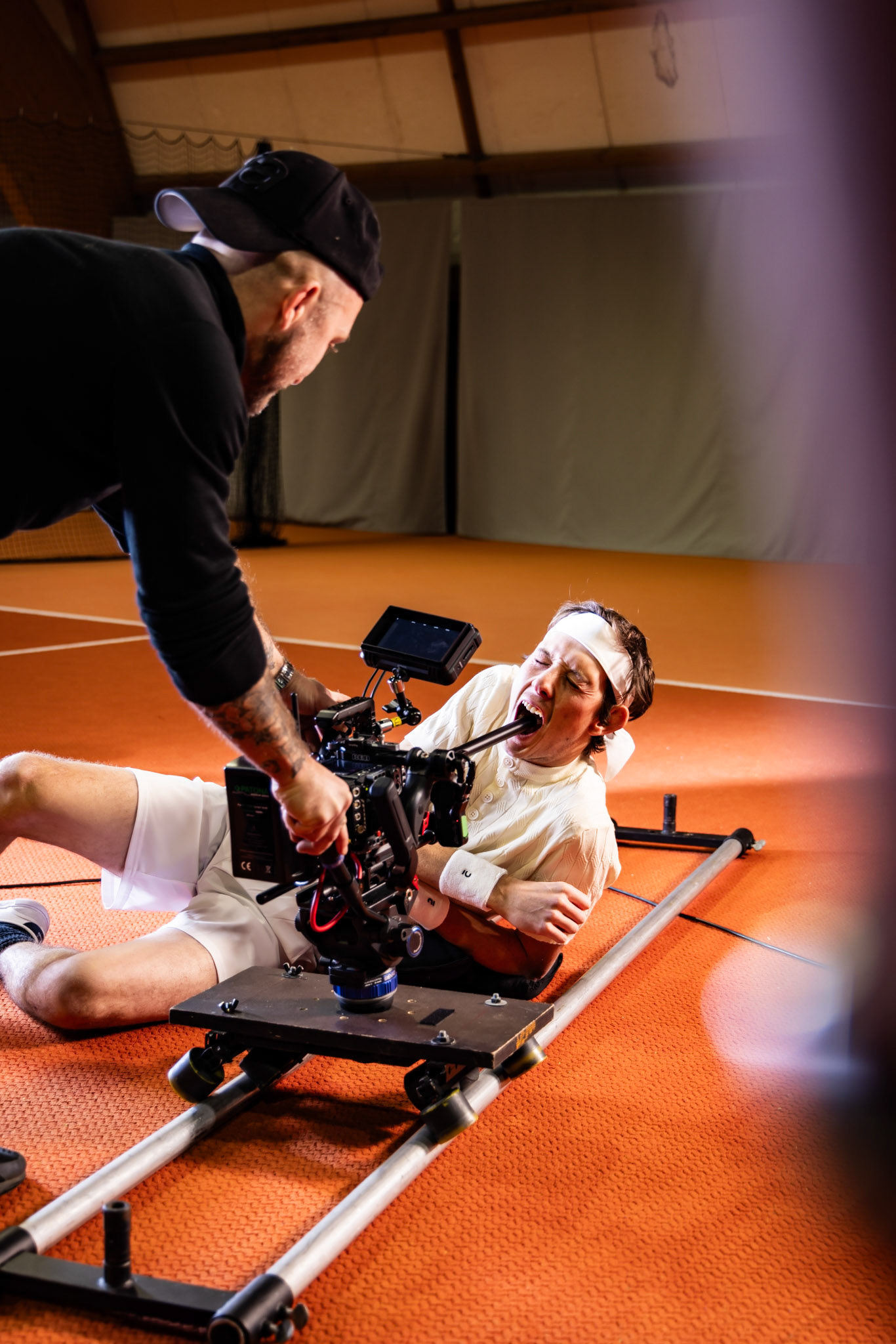 jacob muller operating the camera on set for fabric fitness