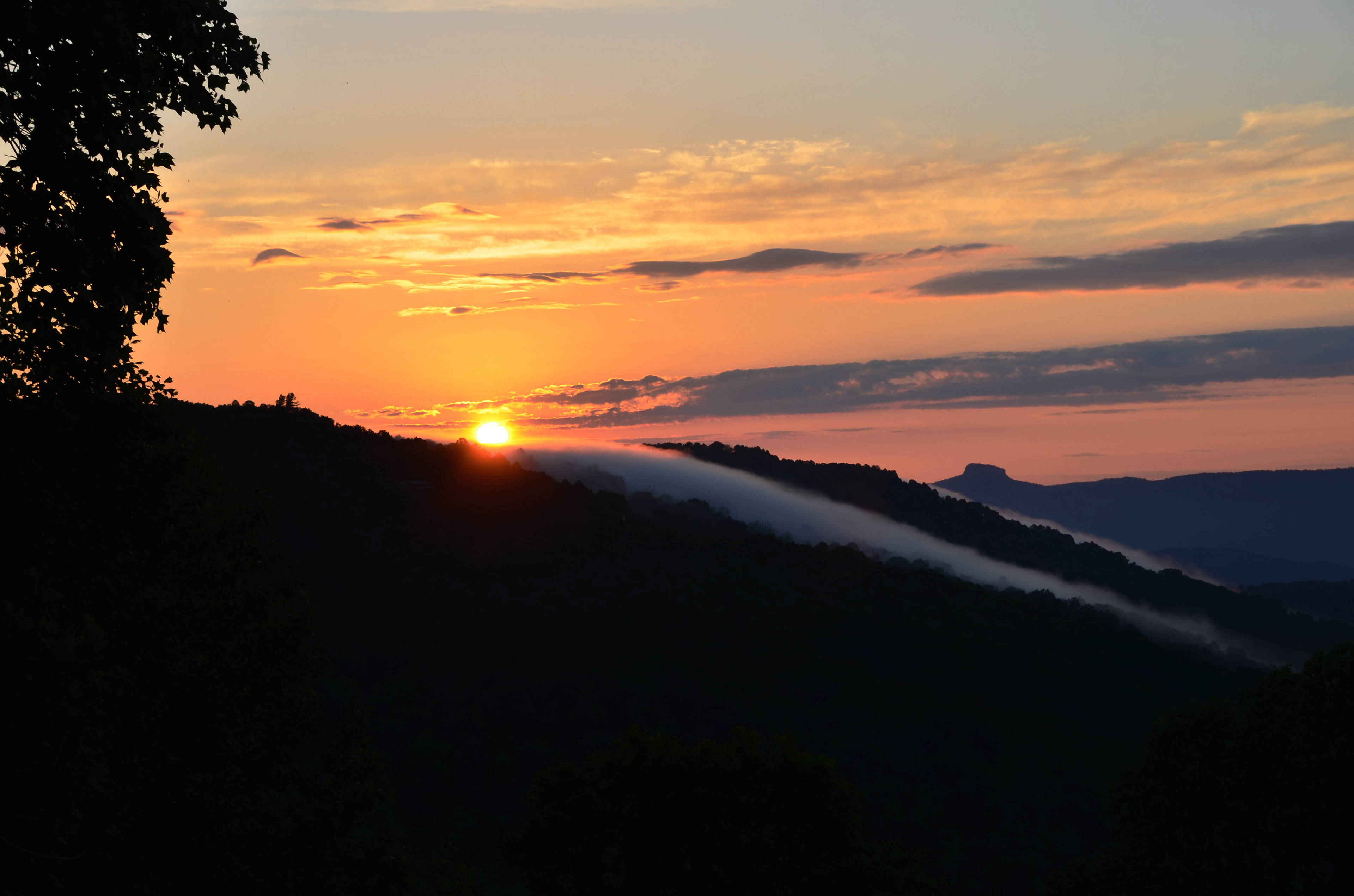 View of sunrise and Table Rock from Little Switzerland
