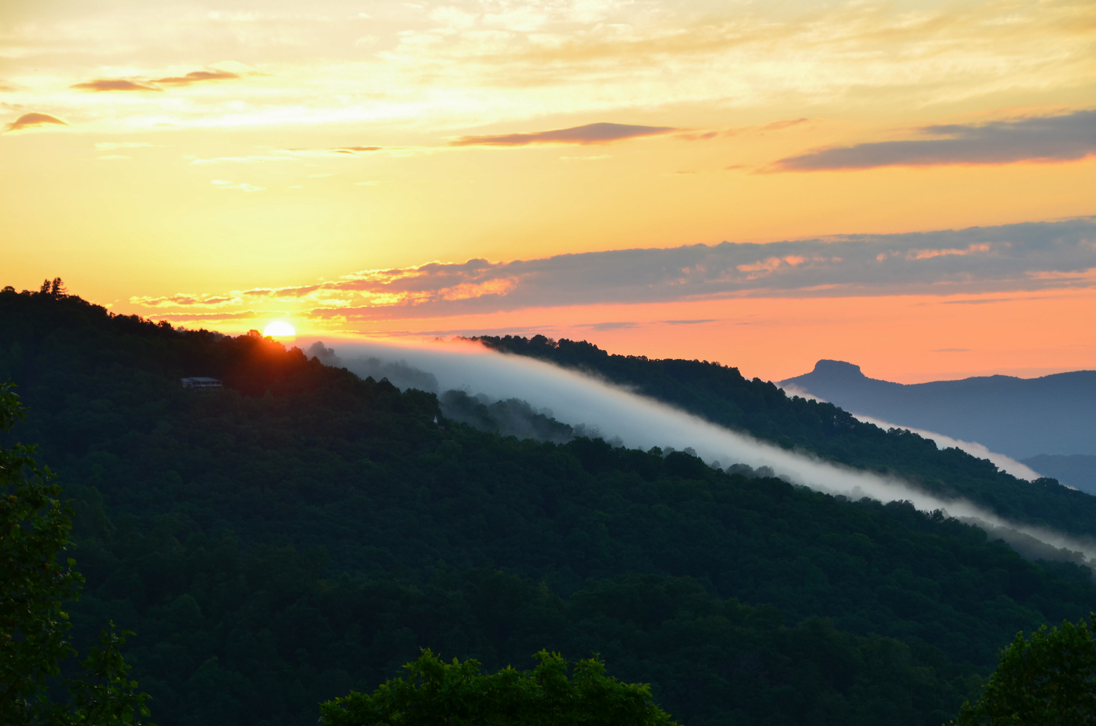 View of sunrise and Table Rock from Little Switzerland