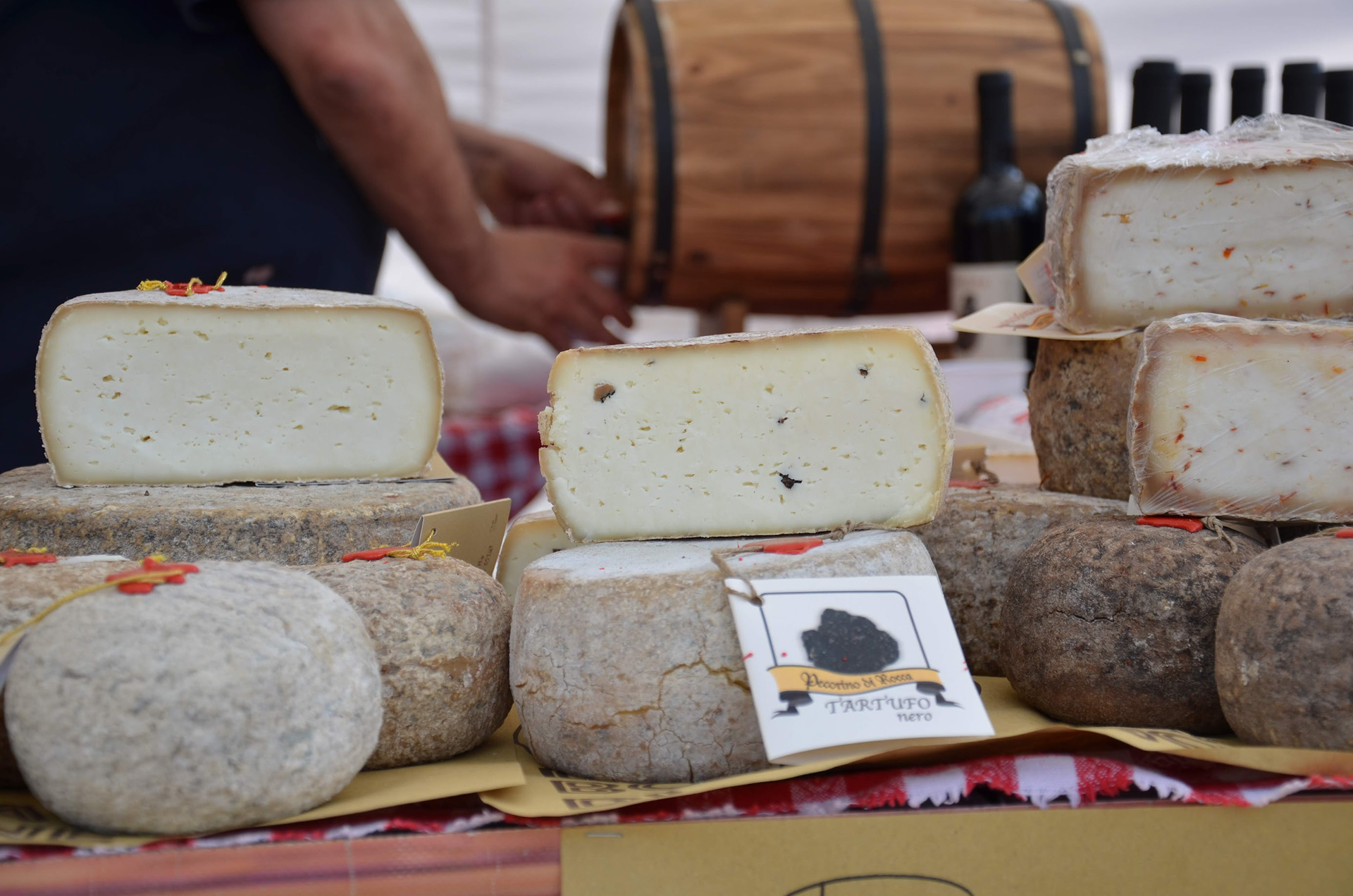 #14 Italian Cheeses, 2013, Photo uses depth of field to focus on the foreground of Pecorino cheeses from Italy.