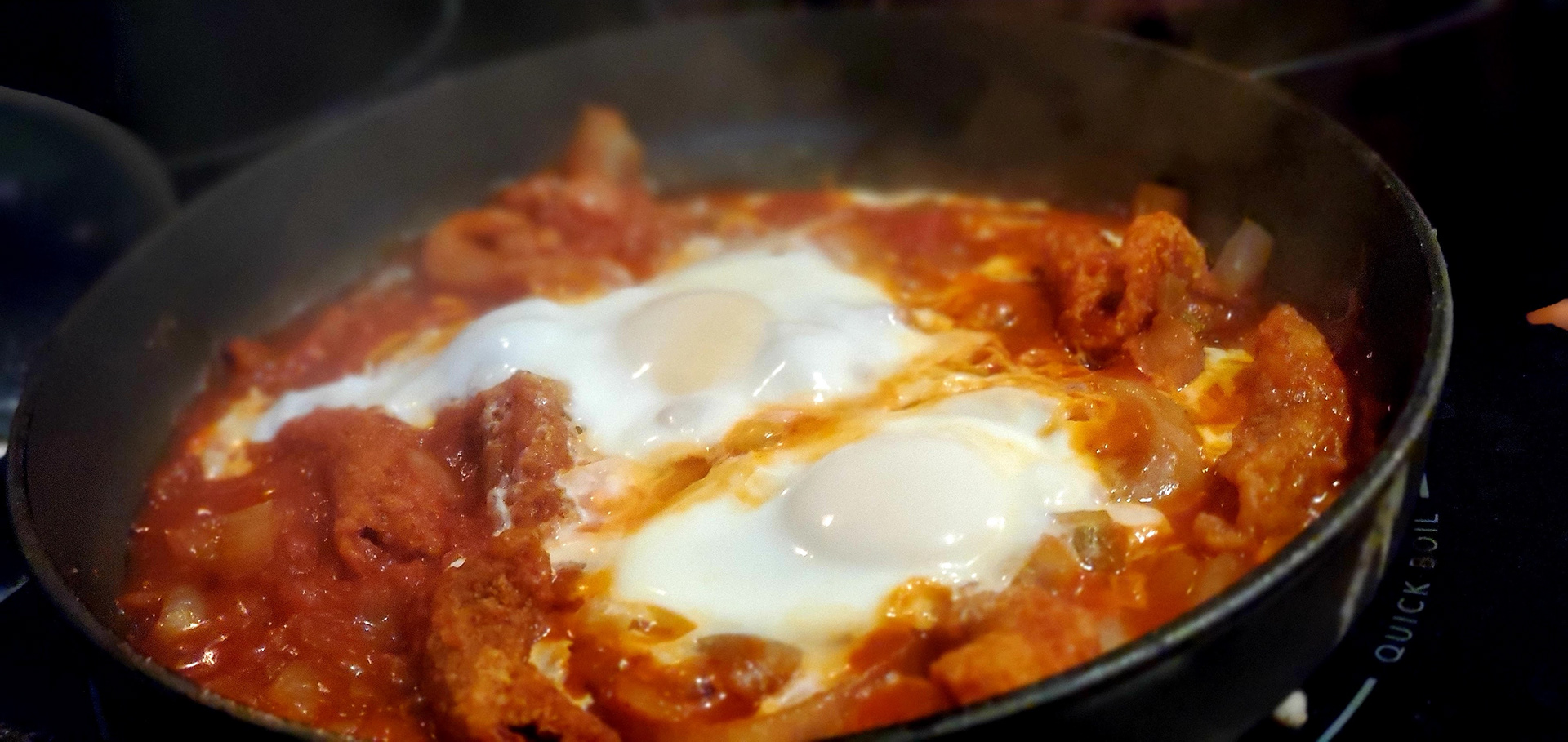 #13 Shakshouka, 2021, Photo uses depth of field to focus on a pan of Shakshouka.