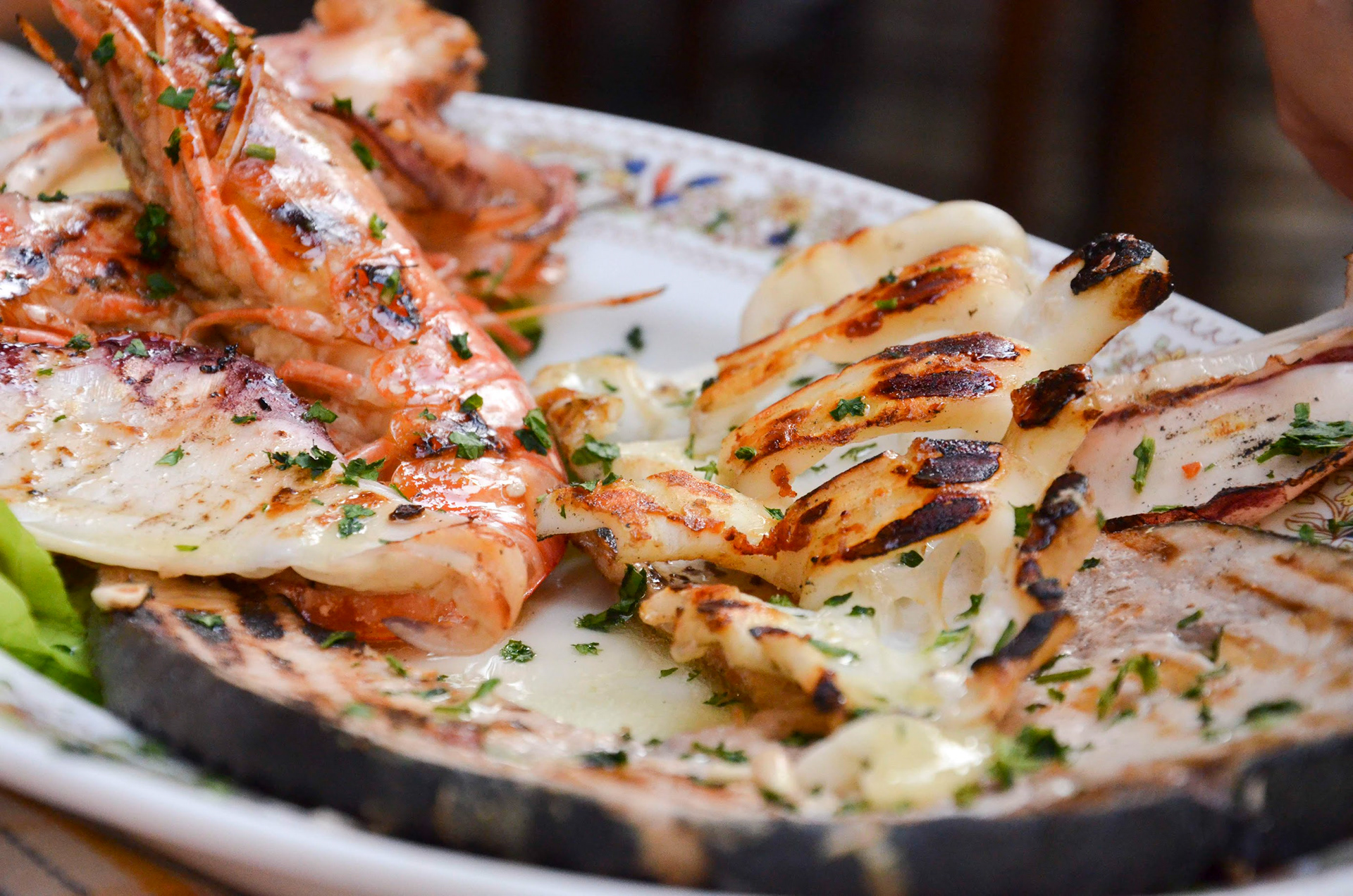 #12 Grilled Prawns, 2020, Photo uses depth of field to direct the eye to the plate of grilled prawns and halloumi cheese.