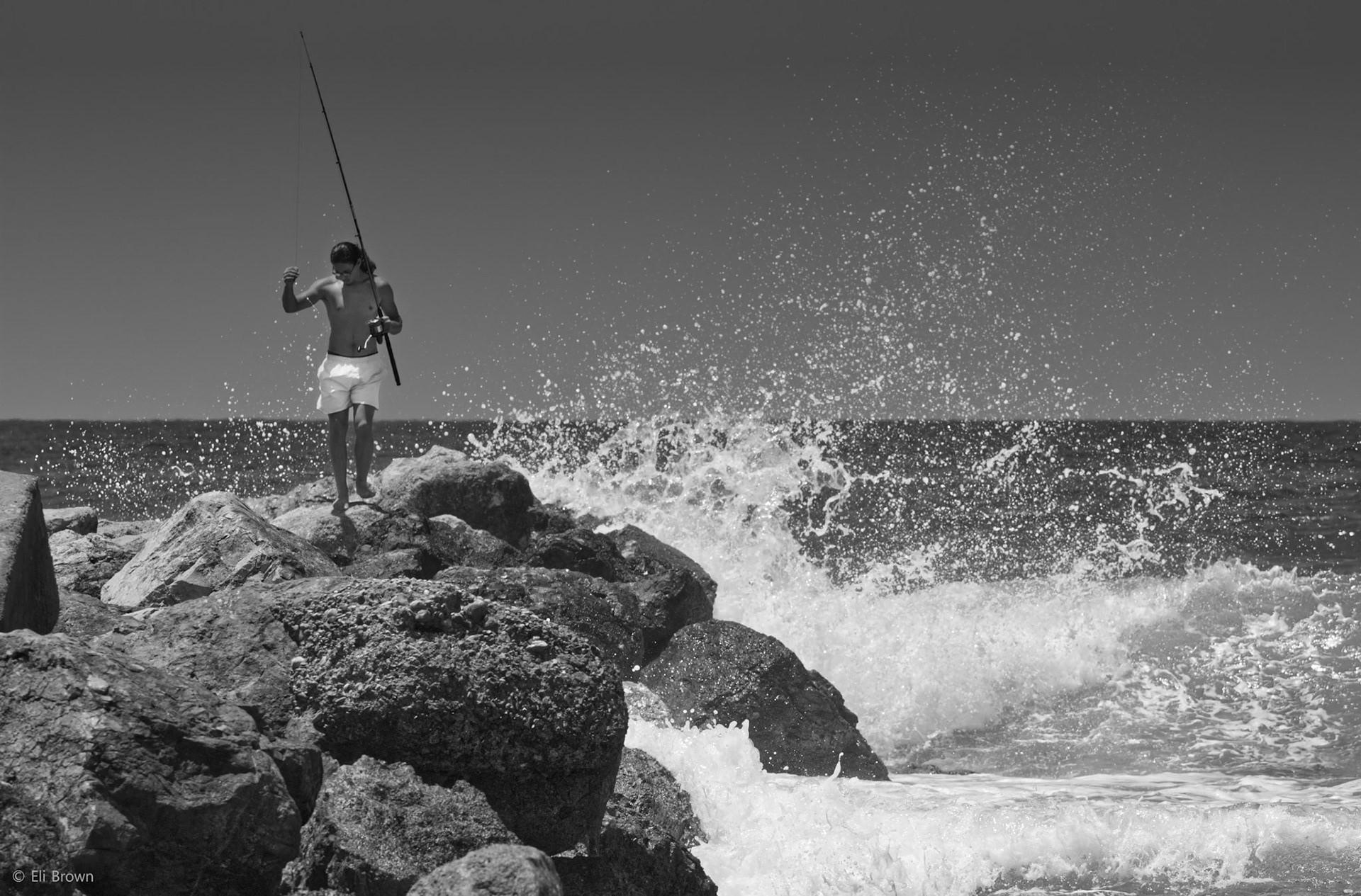 One of my favorite things to do is go to the beach and find interesting people doing interesting things,  I spent a whole hour just watching this one guy at the beach in Heifa, Israel until i got the perfect shot with him on the rocks and the waves crashing against the rocks.. Let me know what you think
