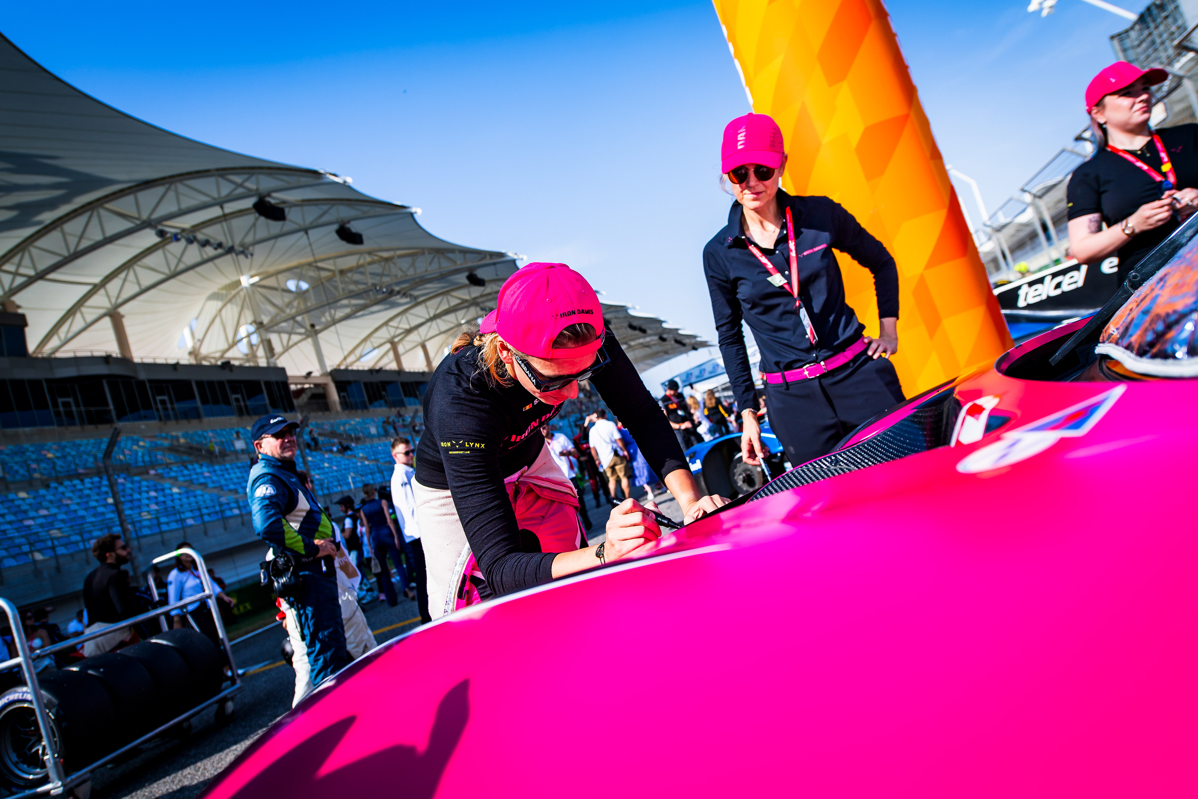 S. Bovy signing her car bonnet