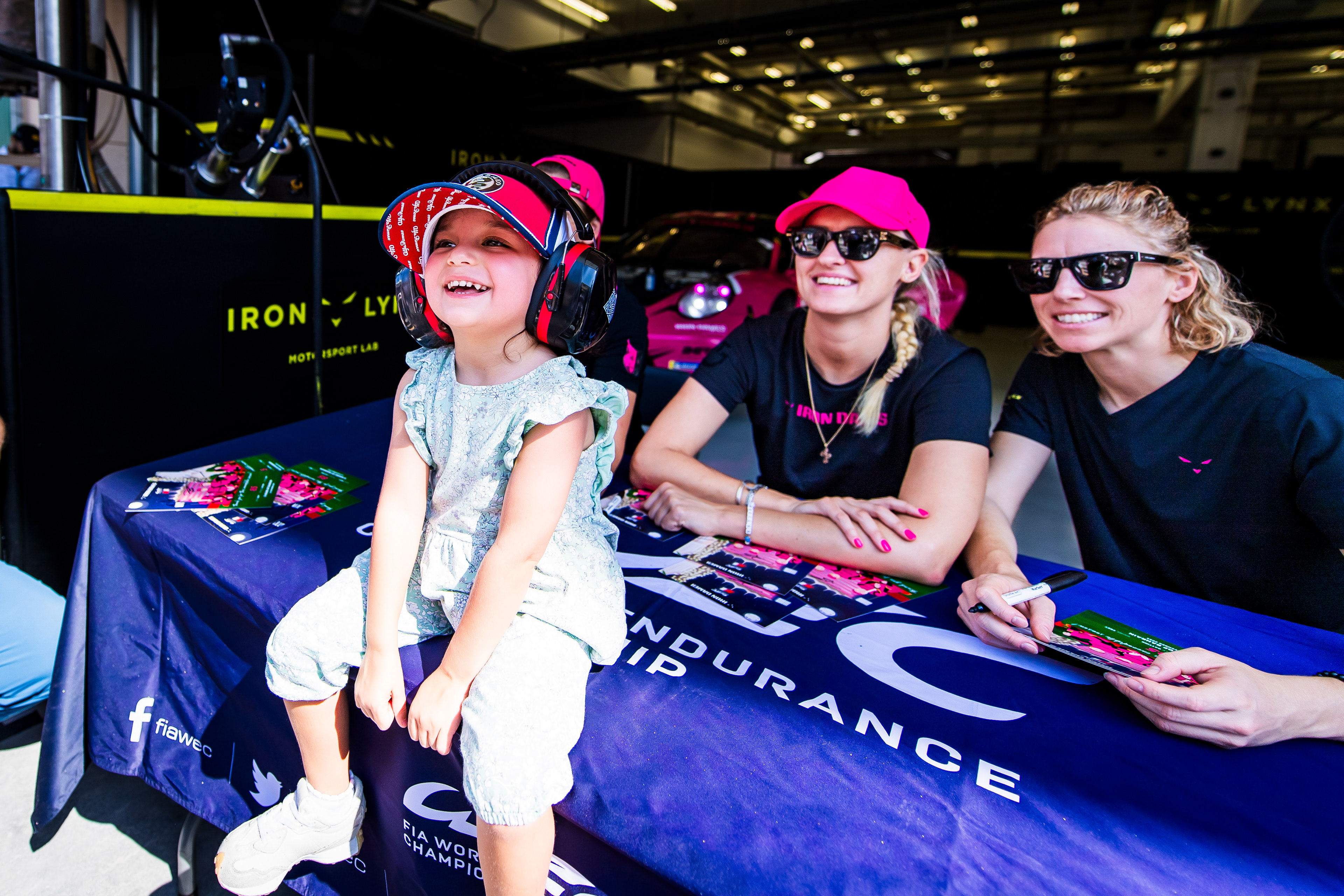 Iron Dames Drivers with their little Fan.