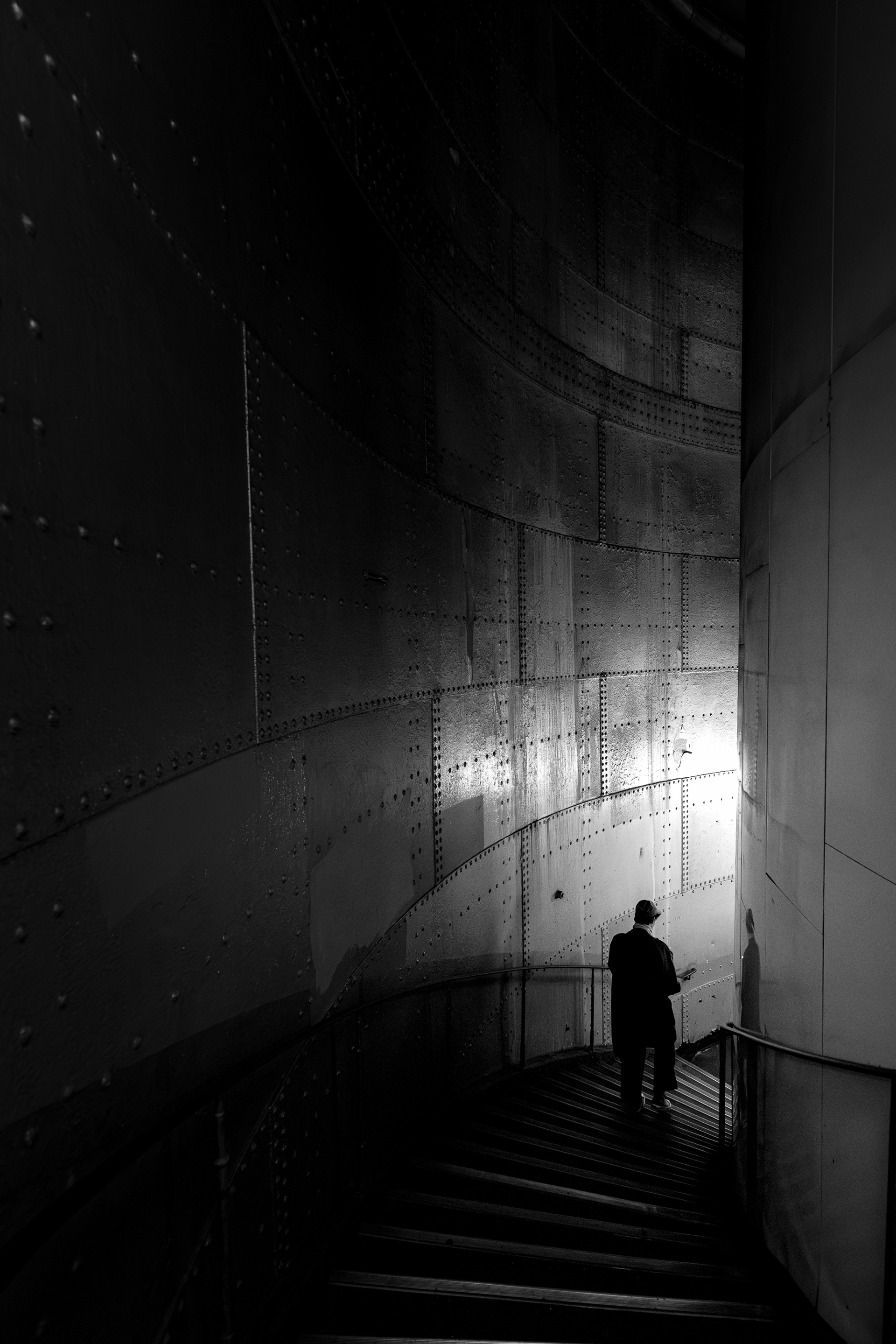The Last Turn. A solitary figure, drawn into the curve of light and steel. Awarded on 1x.