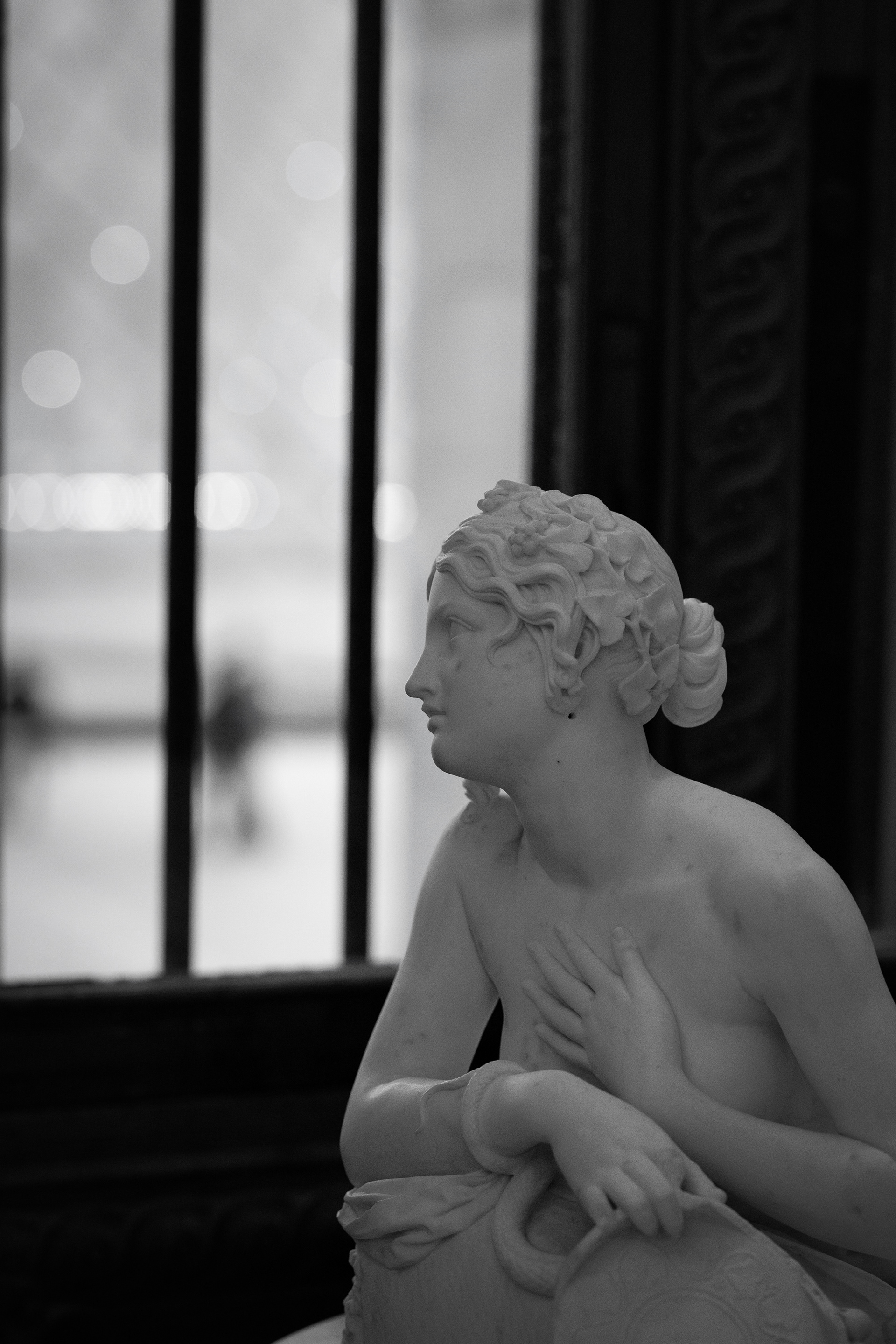 A marble gaze by the window at the Louvre. Featured by bnw.