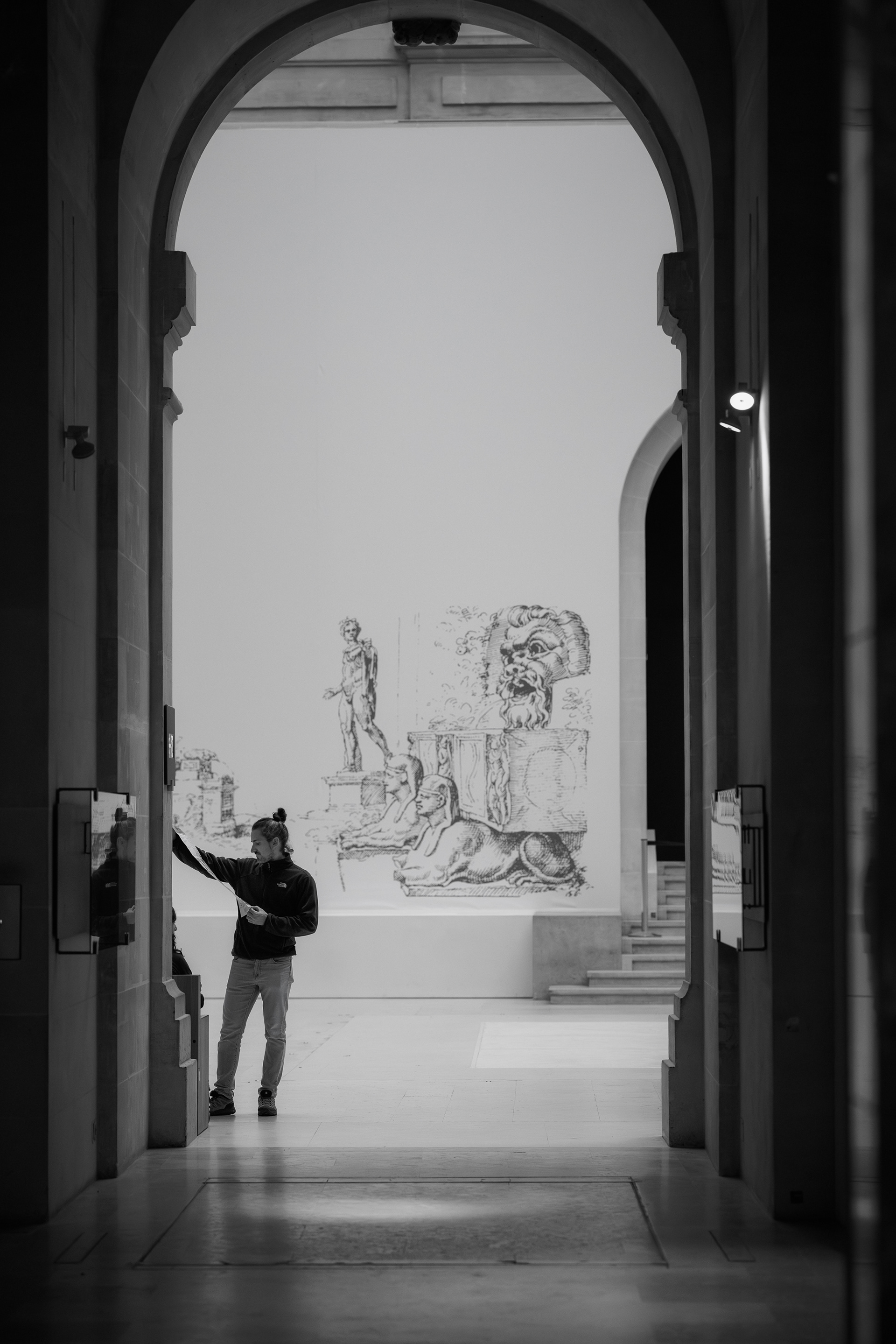Framed by the galleries of the Louvre