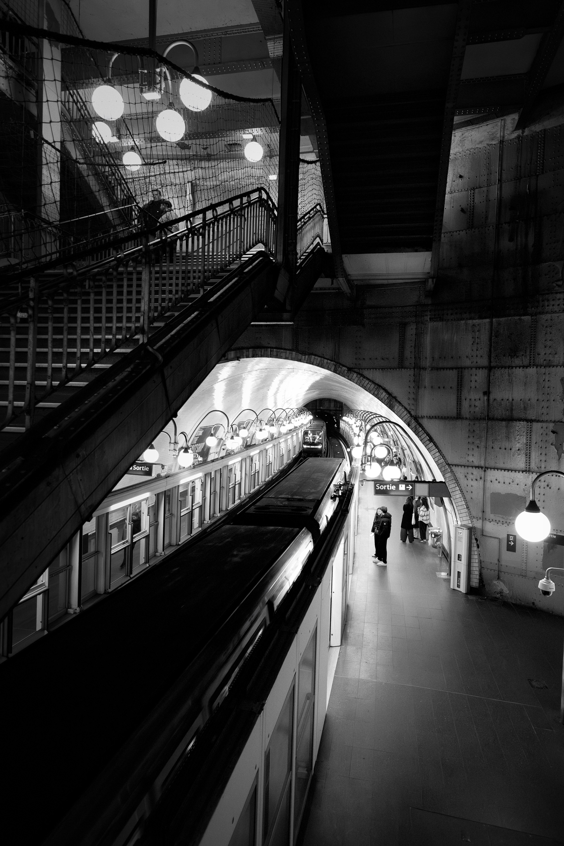 Underground train approaching in Cité subway station, Paris