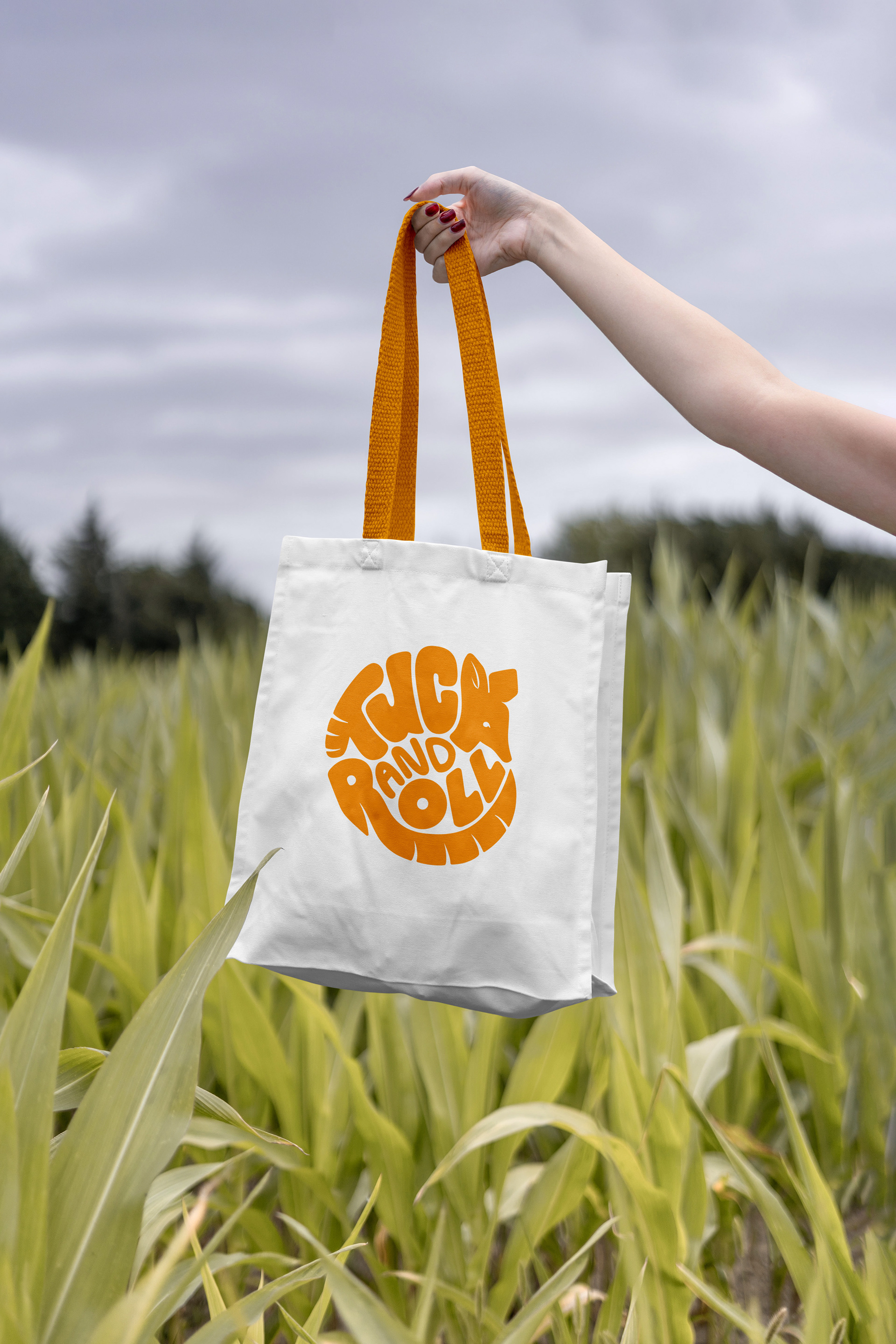 Tuck and Roll: The Art of Armadillos Handlettered logo on a canvas bag