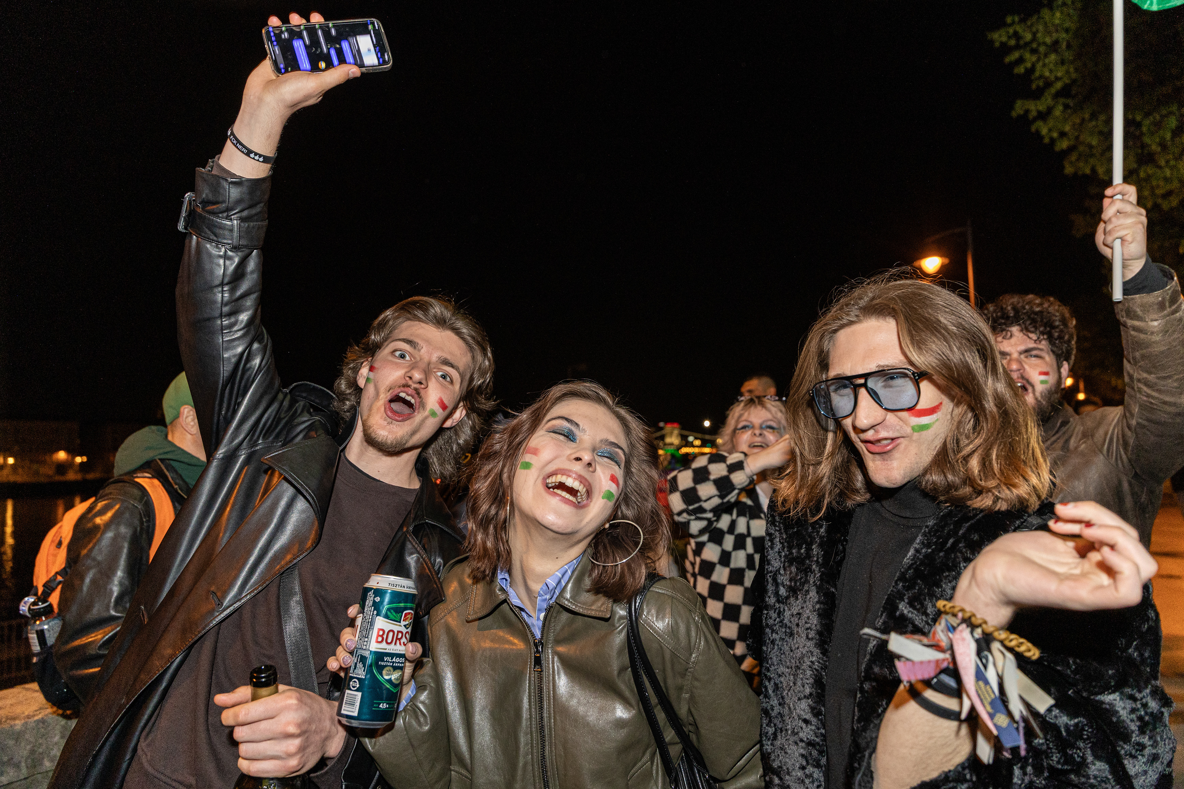 Tisza party supporters celebrate election victory.