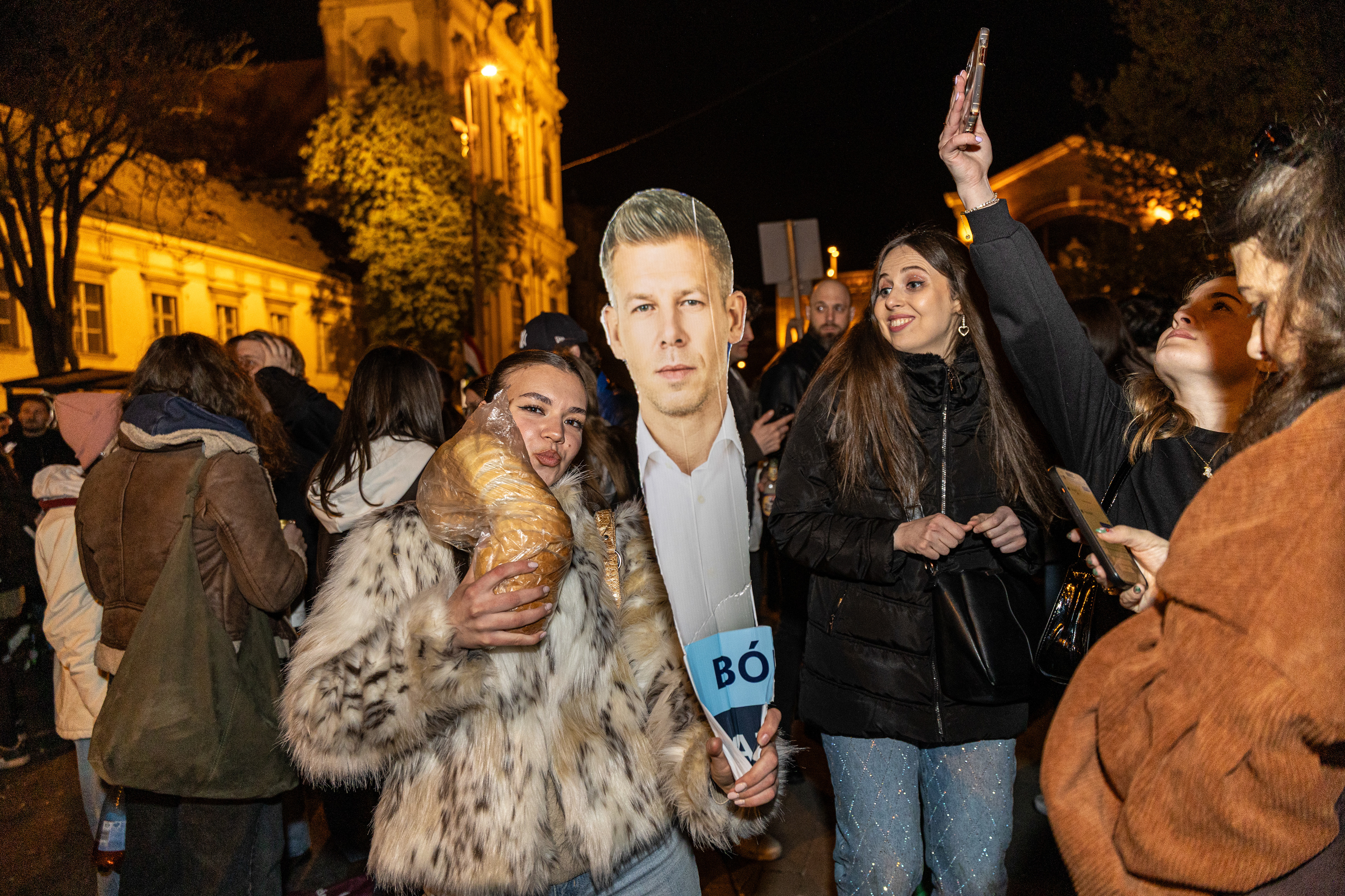Tisza party supporters celebrate election victory.