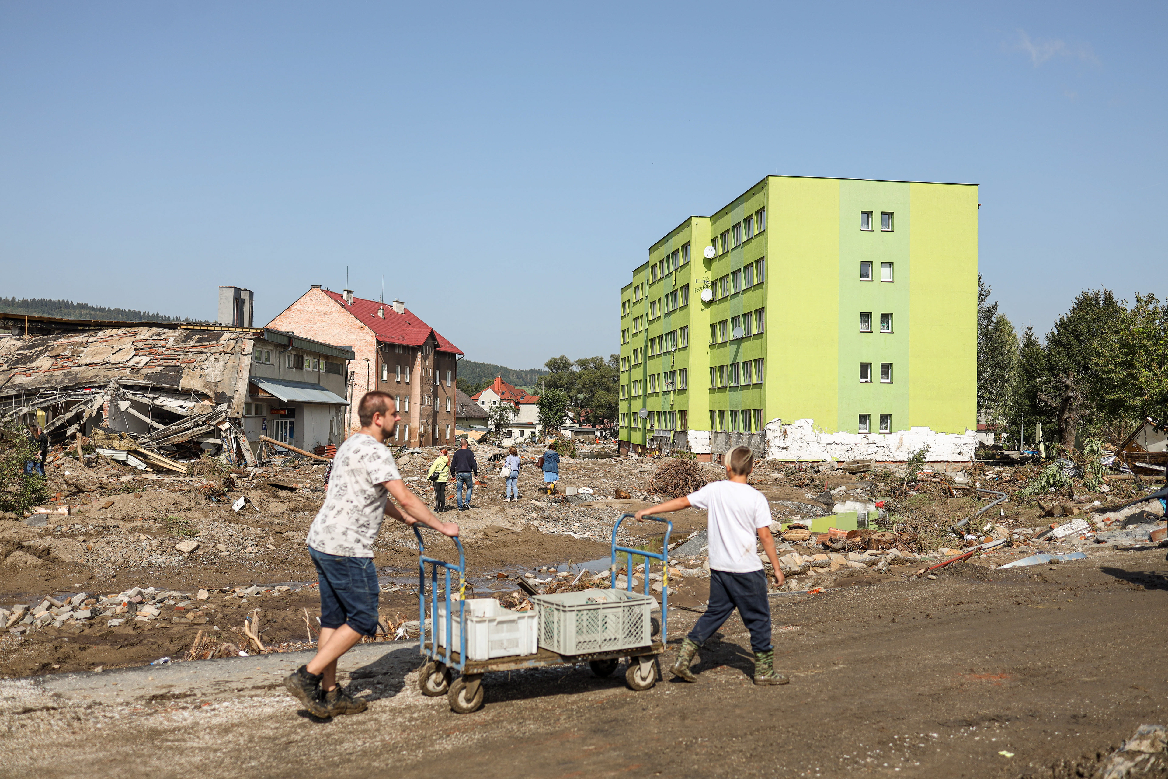 Stronie Śląskie, Poland. Residents return to flooded neighborhoods to recover belongings and clear debris. Many left their homes with nothing, forced to flee within minutes as the water rapidly rose.