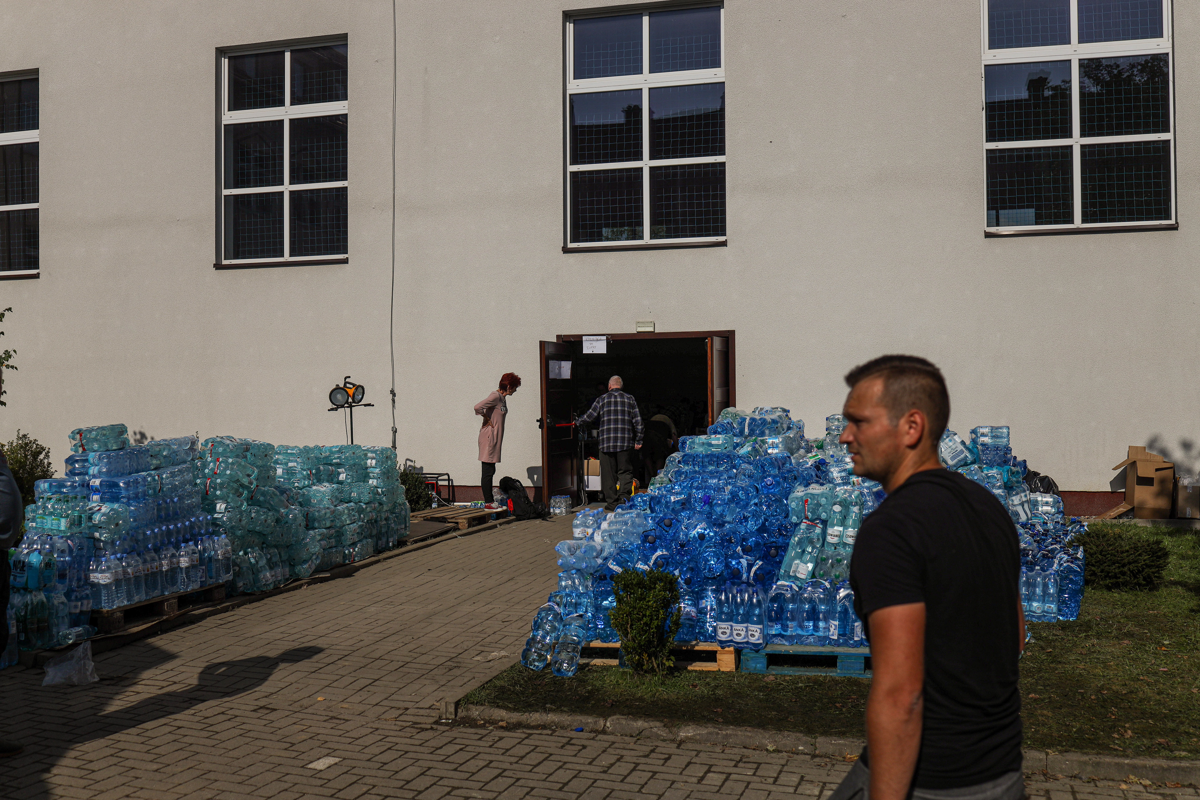Stronie Śląskie, Poland. Pallets of bottled water are stacked outside a relief point as residents collect supplies after the town’s water system was disrupted.