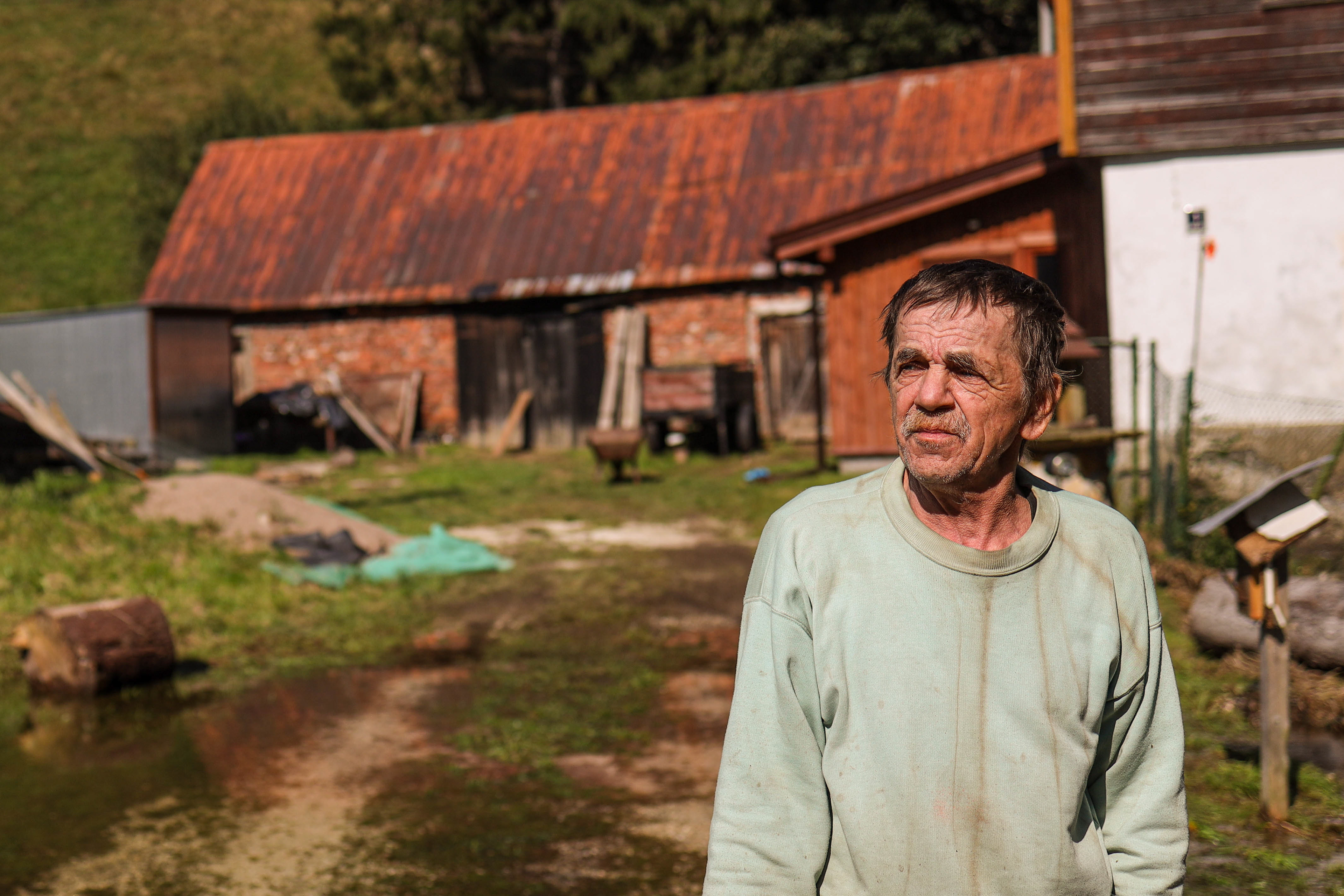 Bielice, Poland. Jan stands in front of his home after the flood, which damaged buildings and left the village isolated without access to basic infrastructure.