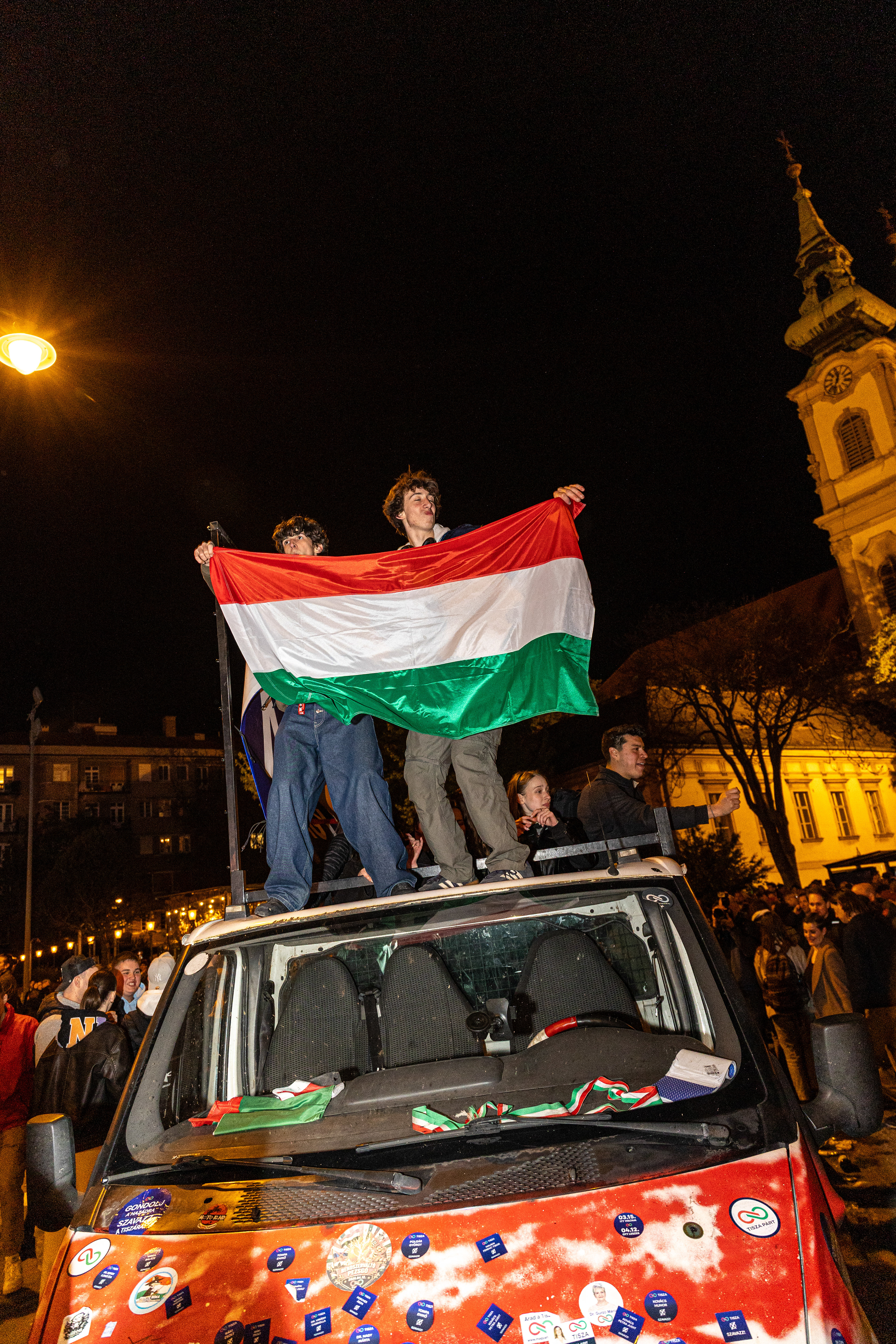 Tisza party supporters celebrate election victory.