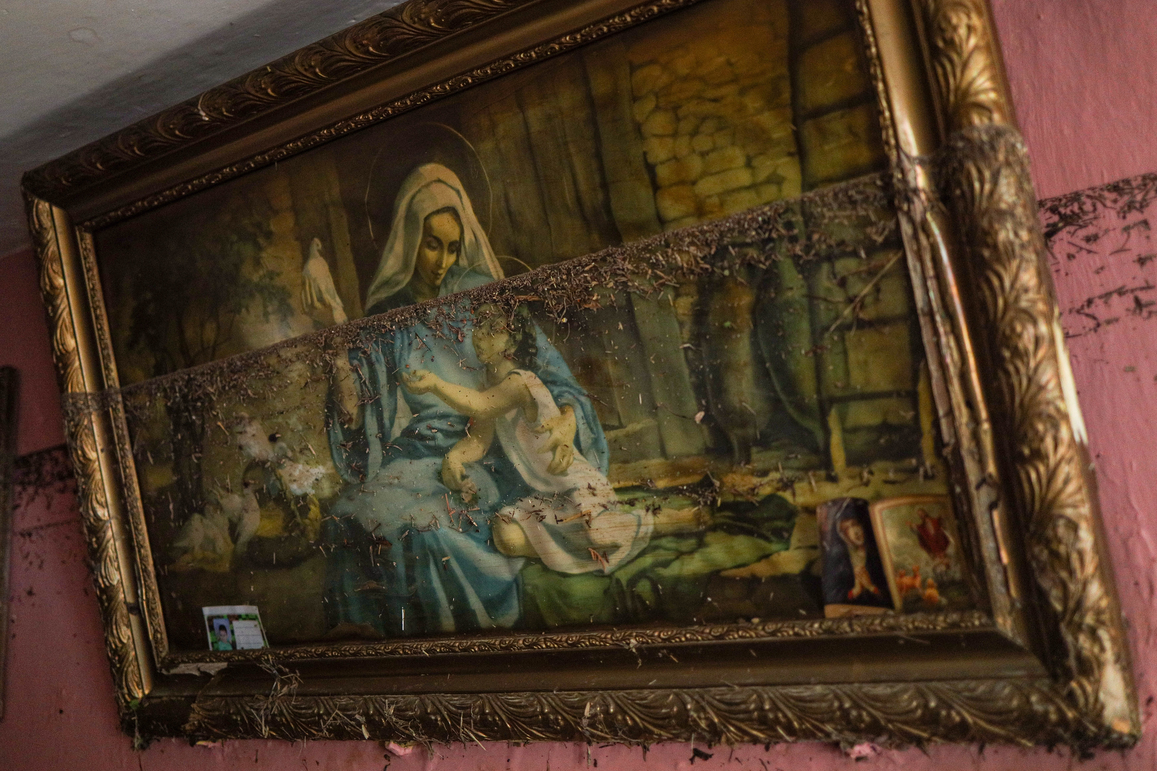 Krosnowice, Poland. A religious painting remains hanging on the wall of Mr. Kazimierz’s apartment, marking the water level left by the flood. The same image survived the 1997 flood in nearly the exact spot.