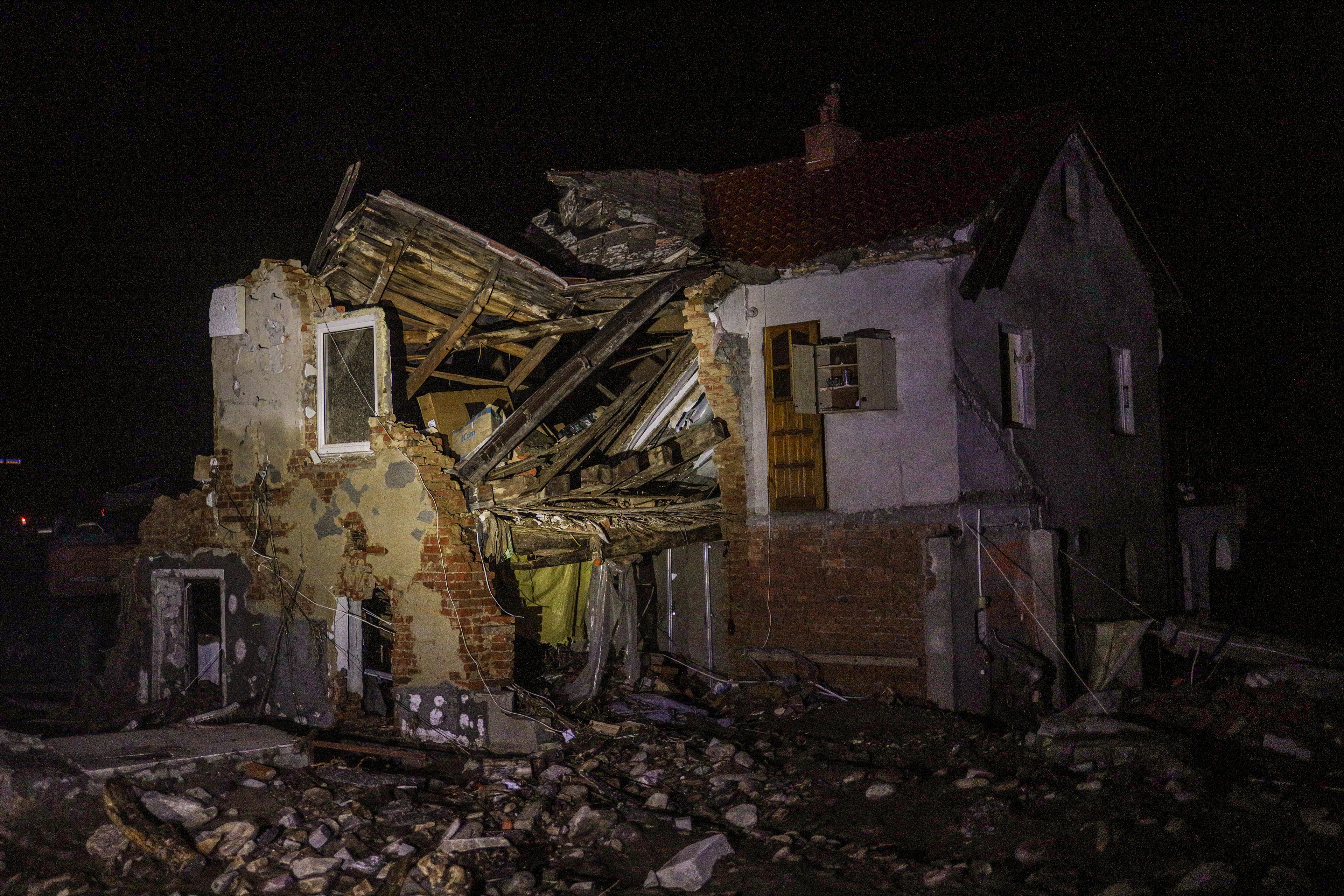 Stronie Śląskie, Poland. A house partially destroyed by the flood stands in darkness, its structure torn apart by the force of the water.
