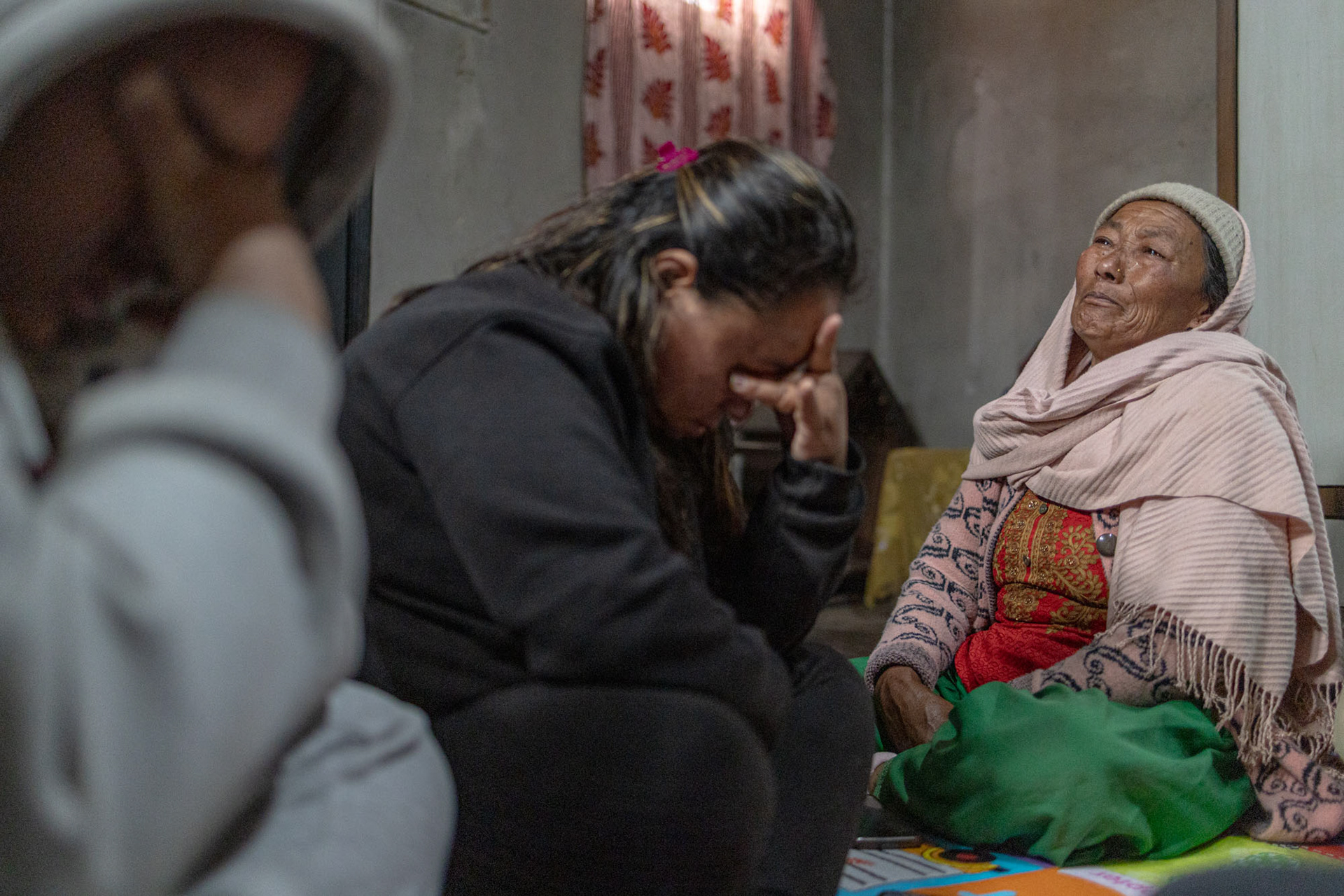 Kathmandu outskirts, Nepal. The family of Binod Sunuwar, who was killed near Bakhmut after joining the Russian army: his son Krishna, wife Shreejana, and mother Naramaya. Like many Nepali families, they took on significant debt to finance his departure, hoping for stable work abroad. Instead, they were left without their main provider, facing uncertainty, financial hardship, and the long aftermath of a war fought far from home.