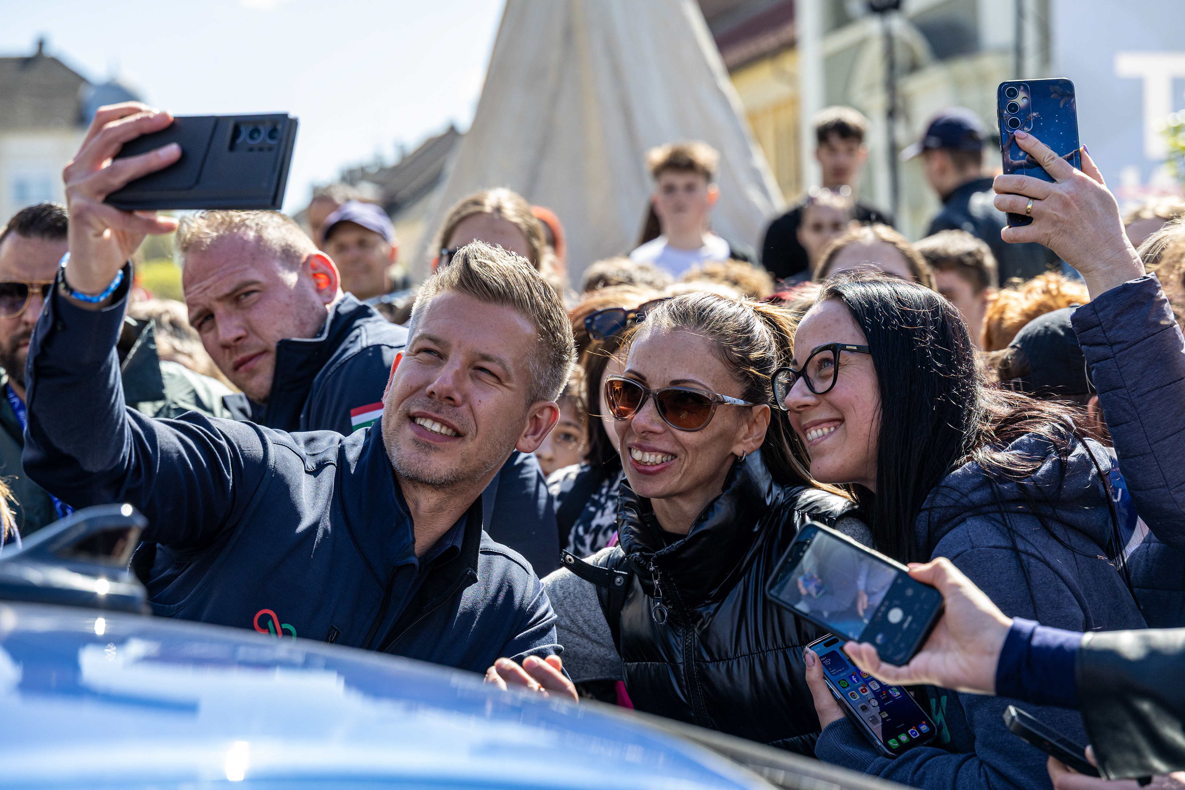 Peter Magyar taking a photo with his supporters.