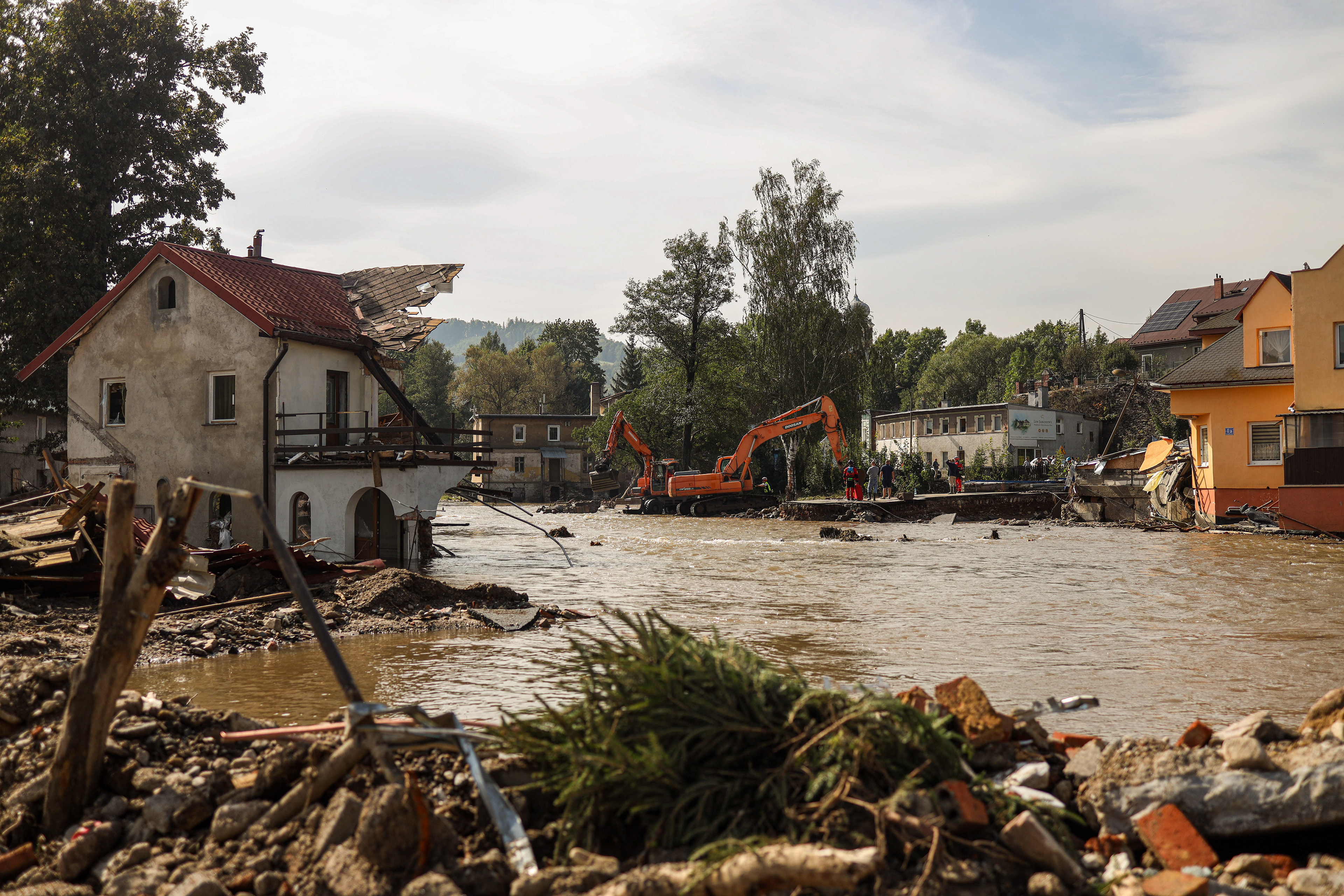 Stronie Śląskie, Poland. Heavy machinery clears debris along the river after floodwaters destroyed buildings and reshaped the landscape of the town.
