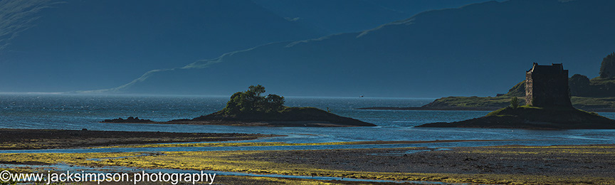 Evening image of Castle stalker nestled in Loch Linnhe, Scotland. Castle Stalker was built in the 16th Century by Duncan Stuart of Appin who later gifted it to King james IV as a hunting lodge. The castle is now in private ownership