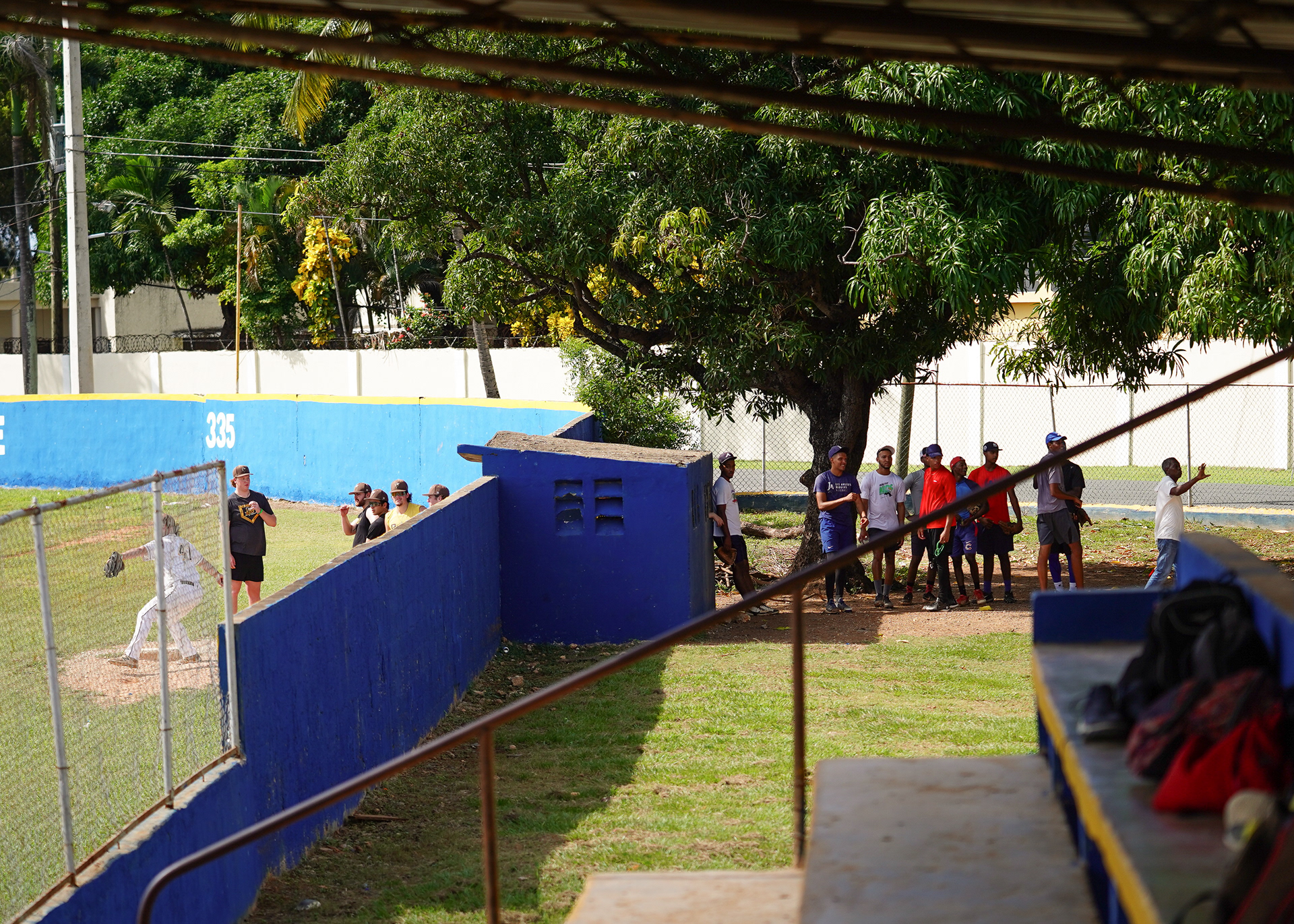 Locals of Santo Domingo conversing with the BW bullpen through a small window.