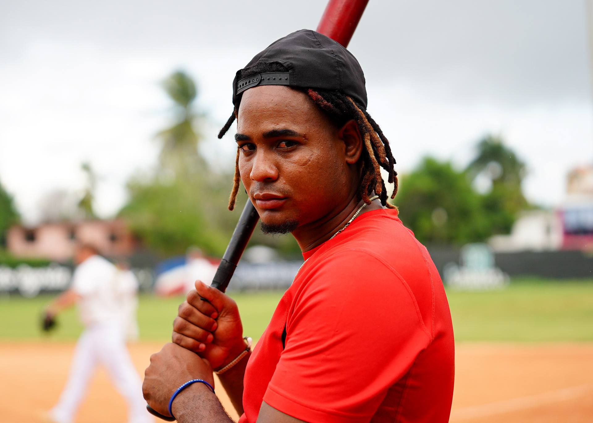 An opposing player from the Dominican Army looks on before the game.