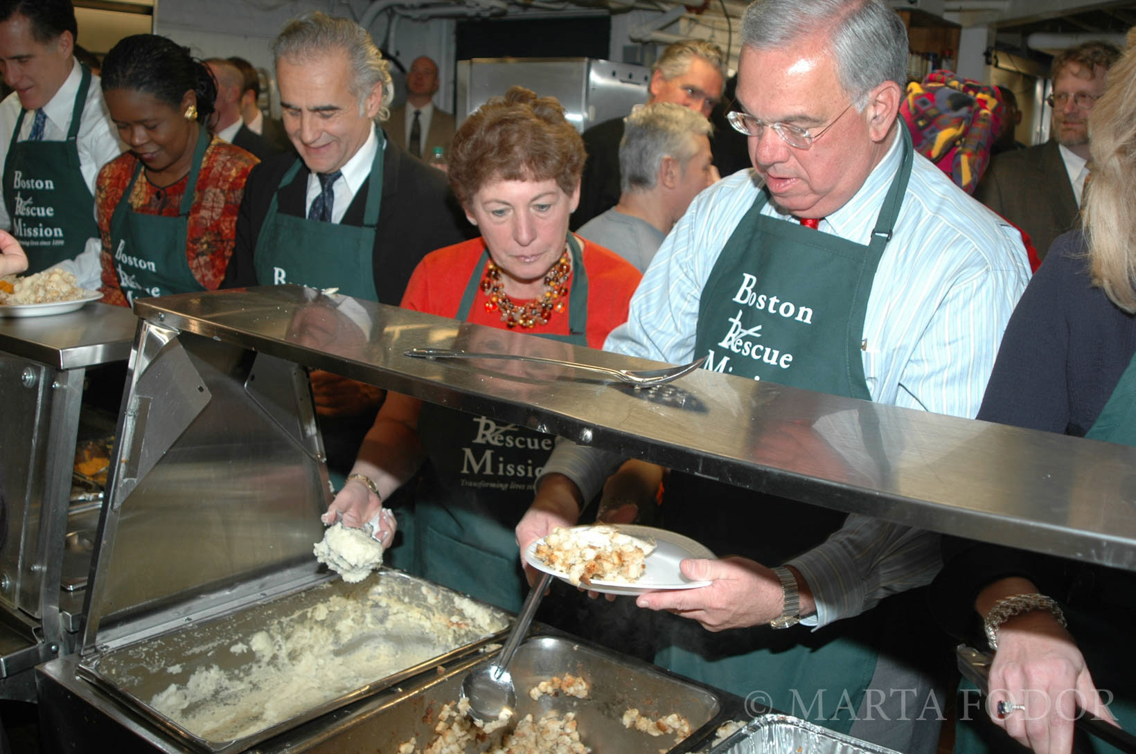 Mayor Thomas Menino serving Thanksgiving dinner, Boston, MA